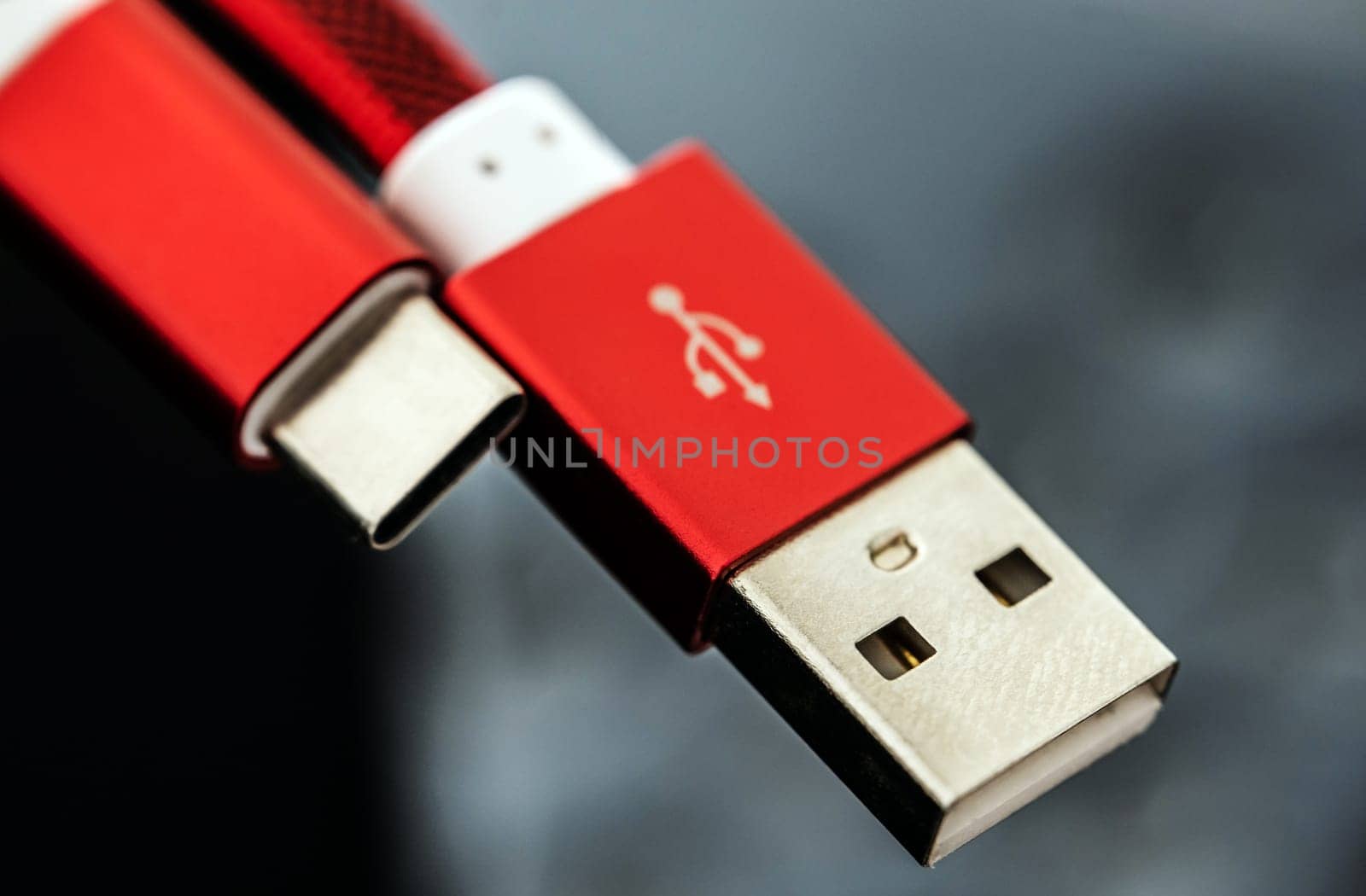 Red connectors usb and usb type C for smartphones and gadgets closeup. Plug micro cable for mobile devices in macro view