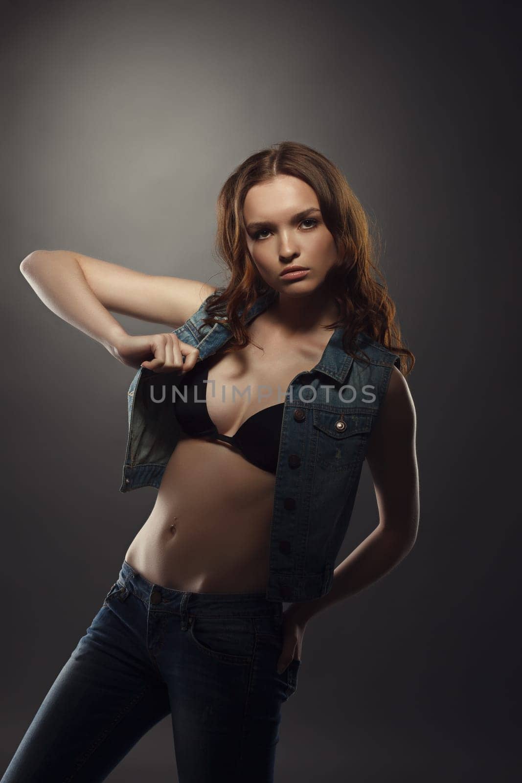 Attractive young girl posing at fashion casting. Studio photo