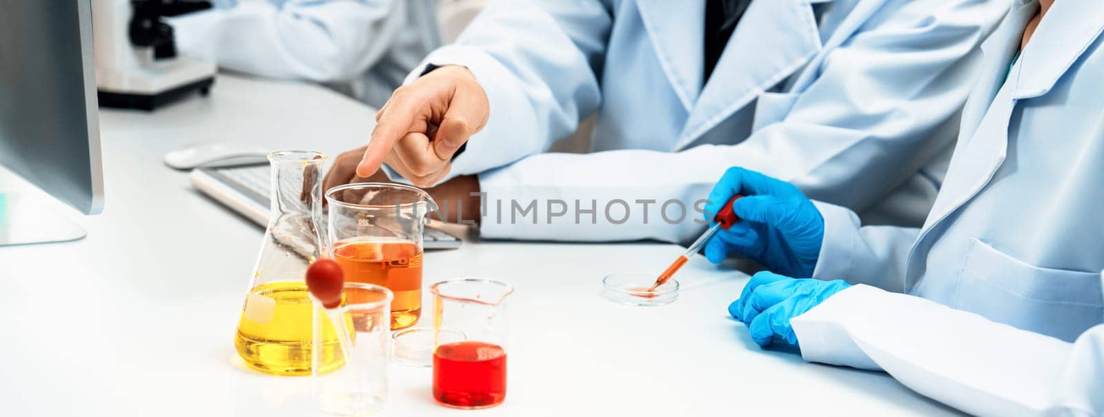 Laboratory researcher team advance healthcare with scientific expertise and laboratory equipment, researching new medicines and developing cure in the lab. Panorama Rigid