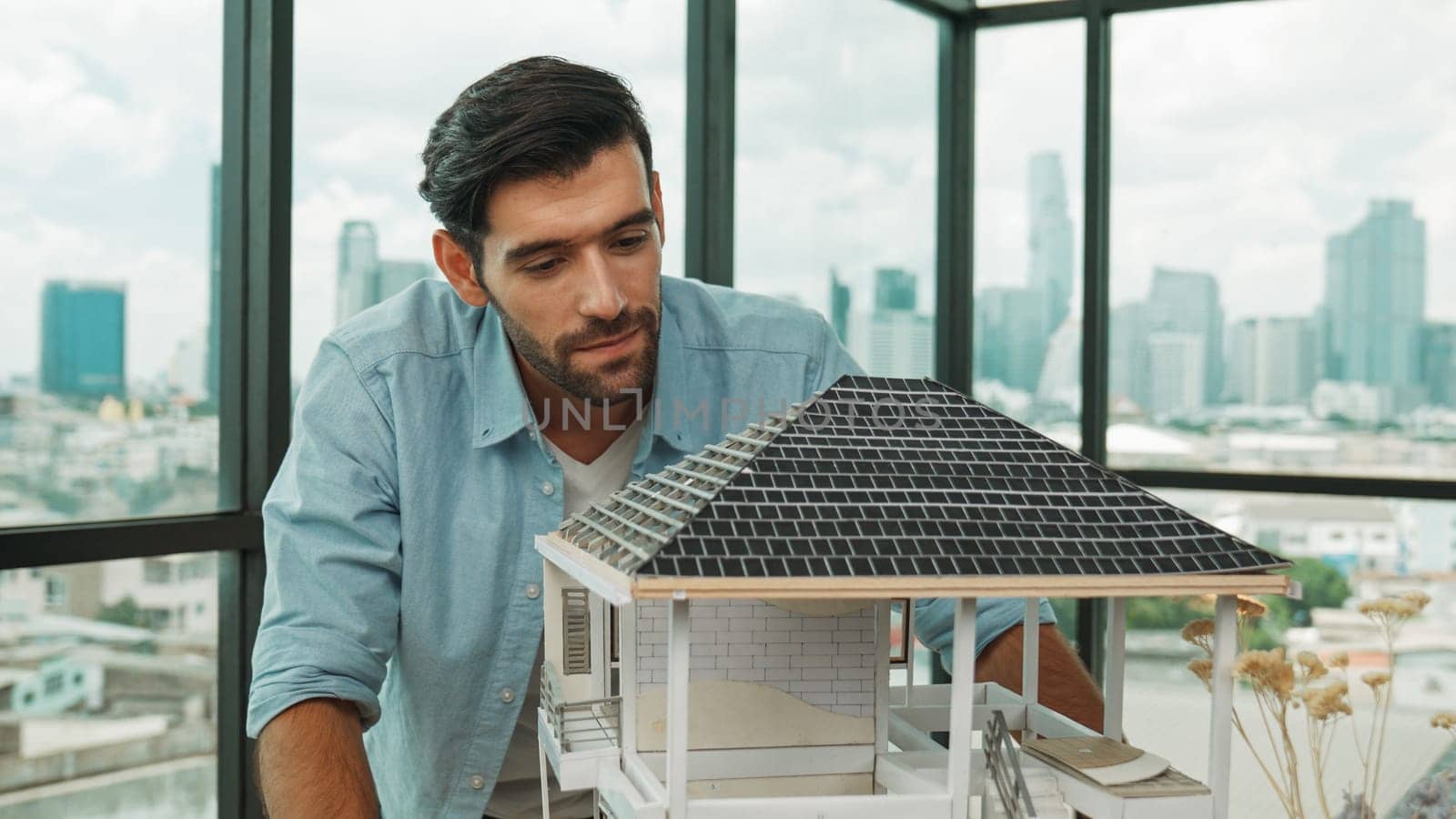 Professional architect engineer check, inspect, look architectural model at modern office with skyscraper, cityscape view. Skilled project manager or businessman check house construction. Tracery