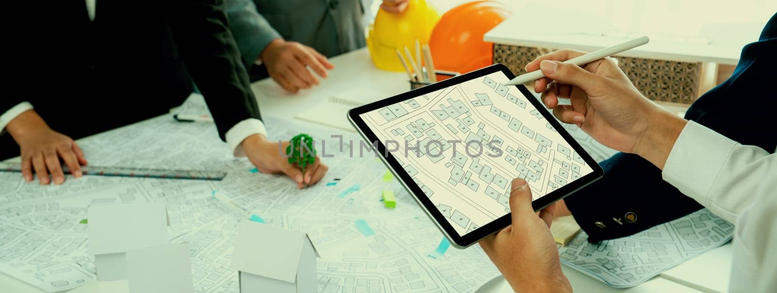 Worker, architect and engineer work on real estate construction project oratory by biancoblue