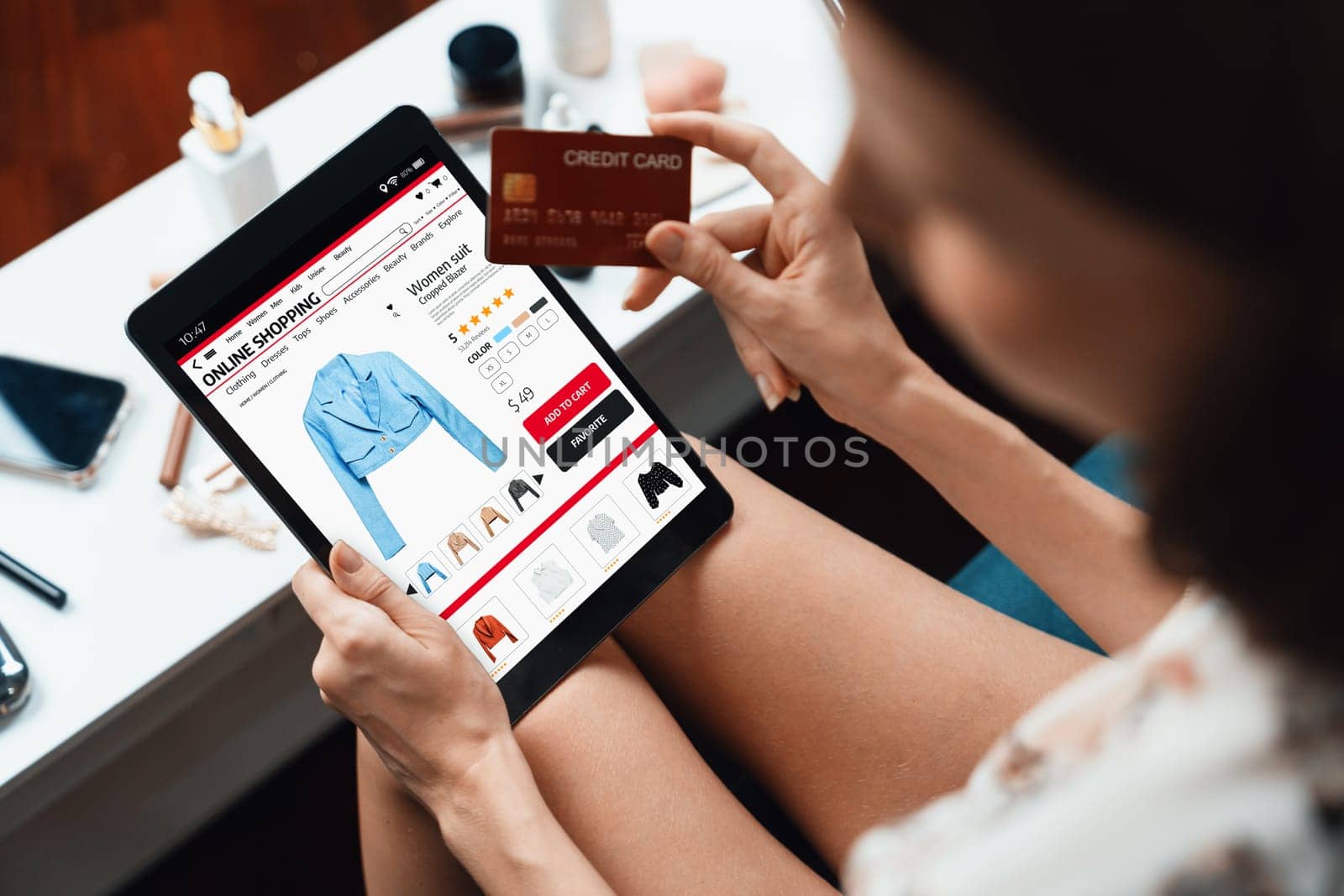 Woman shopping online on internet marketplace browsing for sale items for modern lifestyle and use credit card for online payment from wallet protected by utmost cyber security software