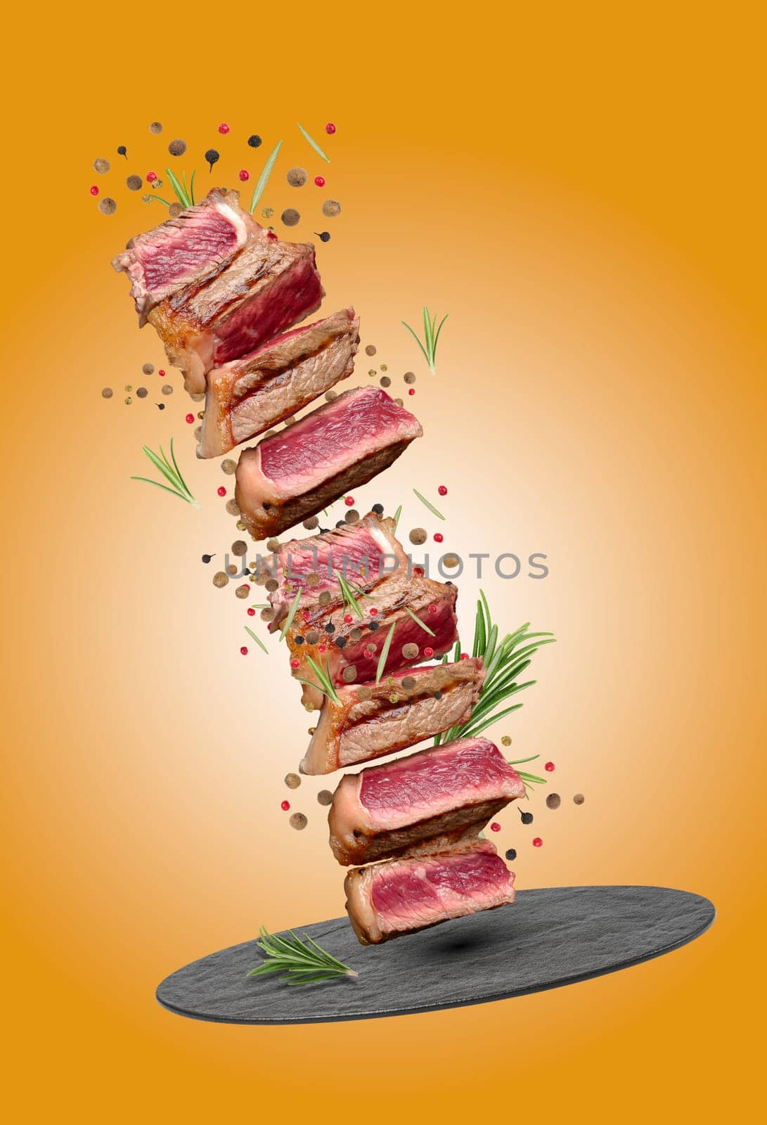 Sliced fried beef steak New York with spices and a sprig of rosemary, degree of doneness rare