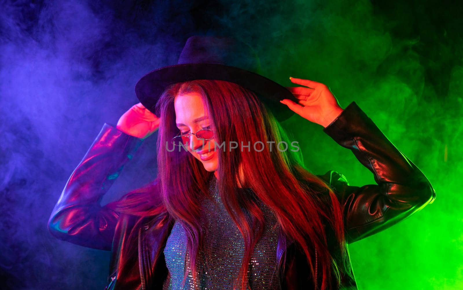 Woman in neon multi-color light. Smoky background, night party, disco club by kristina_kokhanova