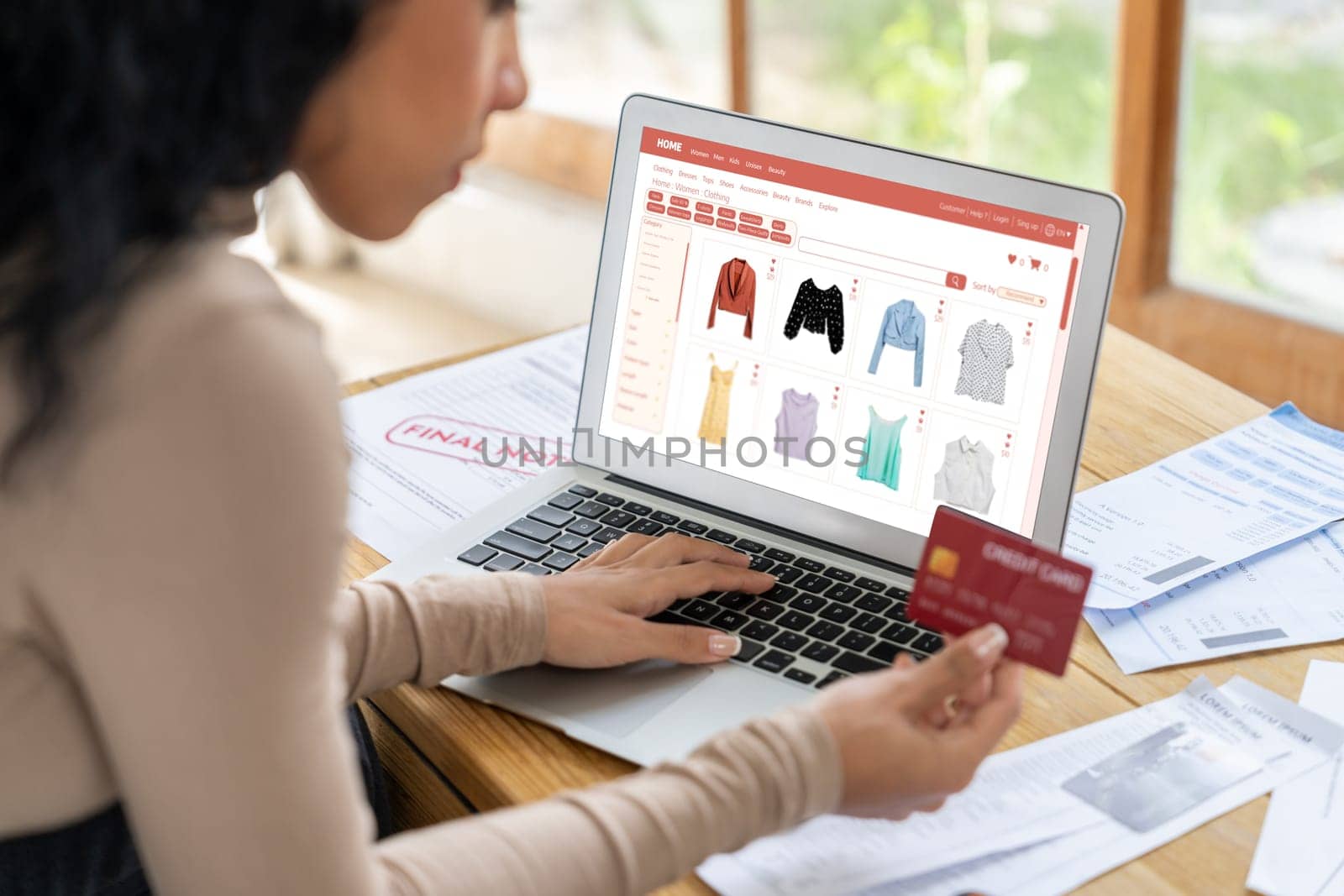 Woman shopping online on internet marketplace browsing for sale items for modern lifestyle and use credit card for online payment from wallet protected by crucial cyber security software