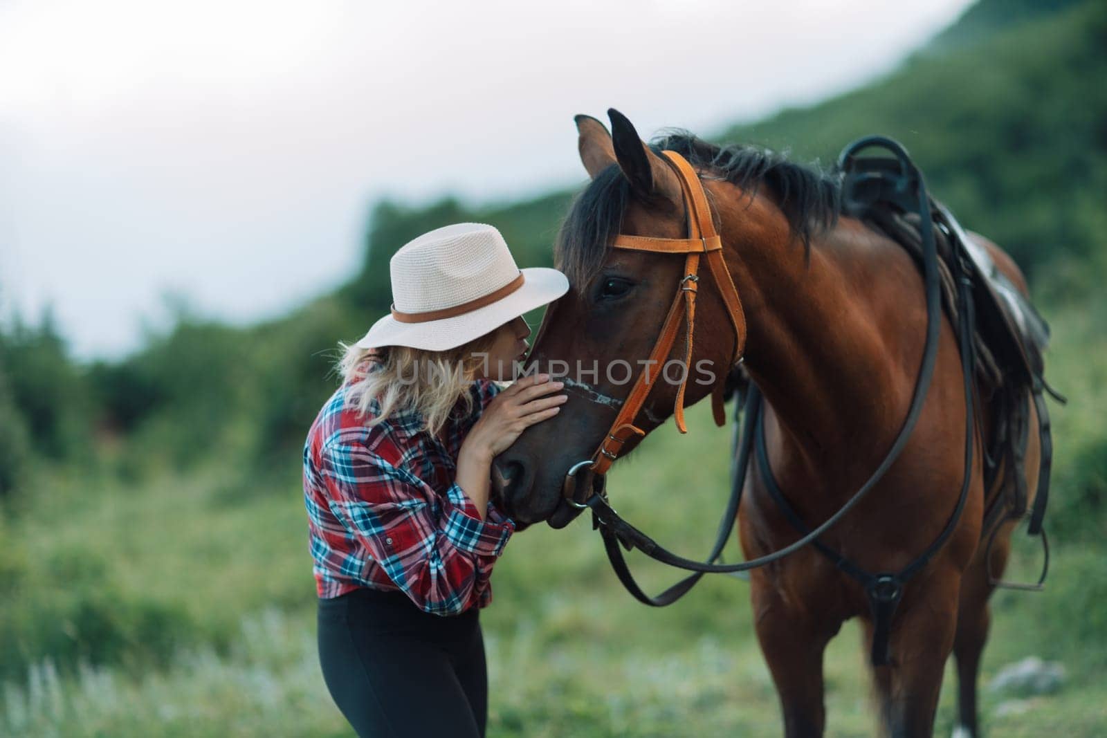 Happy blonde with horse in forest. Woman and a horse walking through the field during the day. Dressed in a plaid shirt and black leggings. by Matiunina