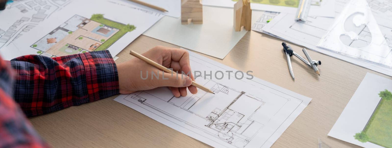 Closeup of architect engineer hand using ruler draw a blueprint. Delineation. by biancoblue
