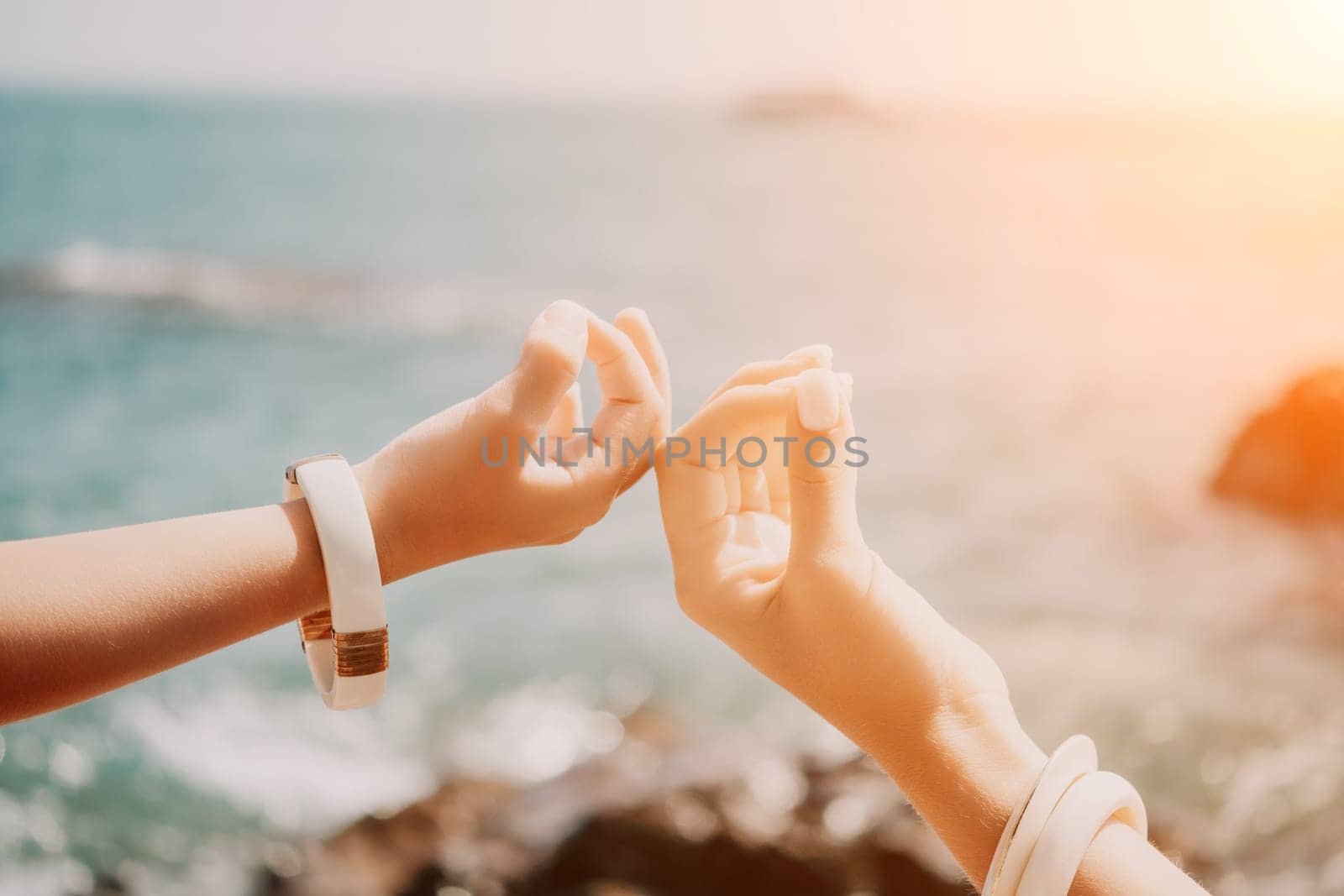 Close up Hand Gesture of Woman Doing an Outdoor Lotus Yoga Position. Close up. Blurred background