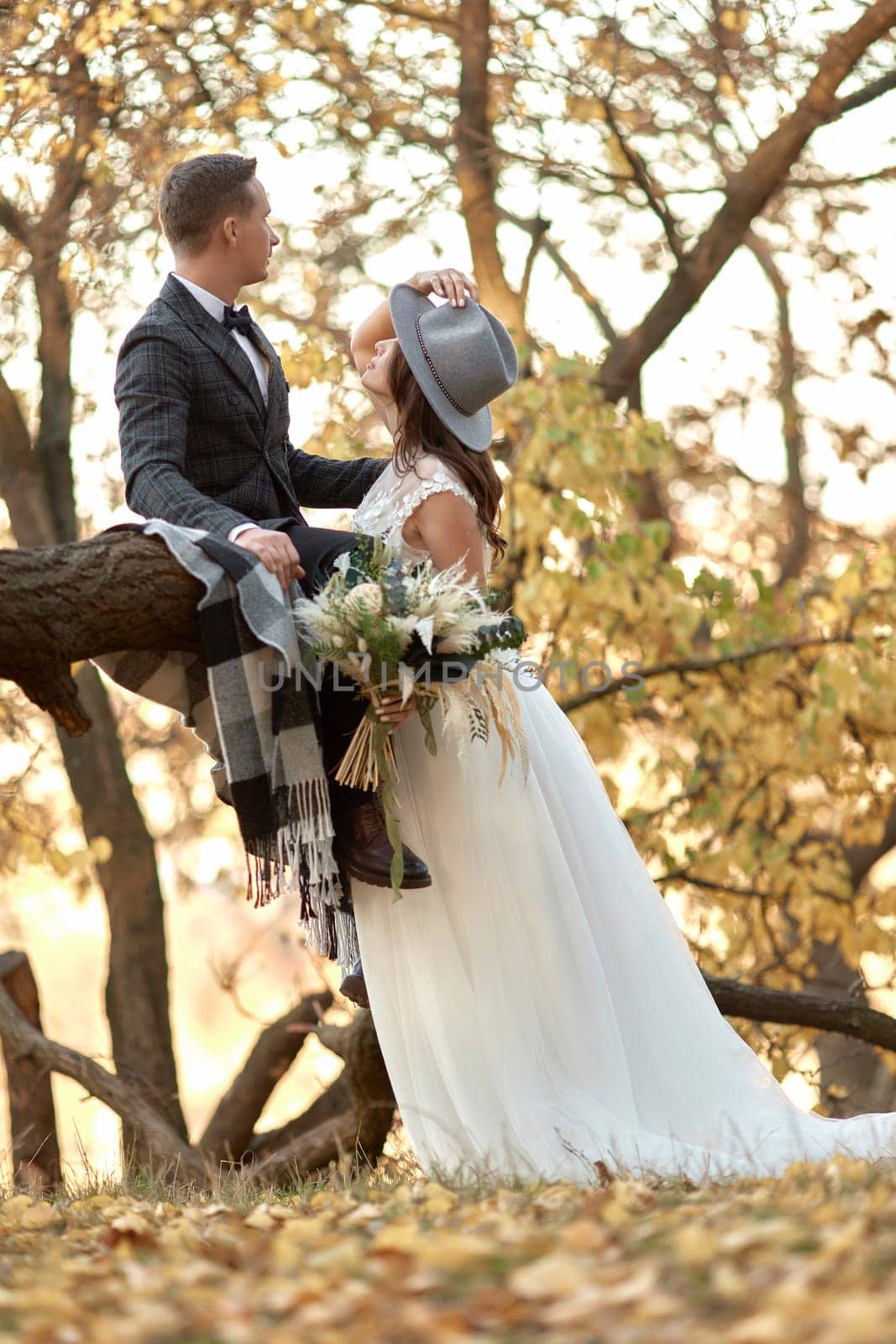 beautiful happy stylish bride and groom outdoor in autumn