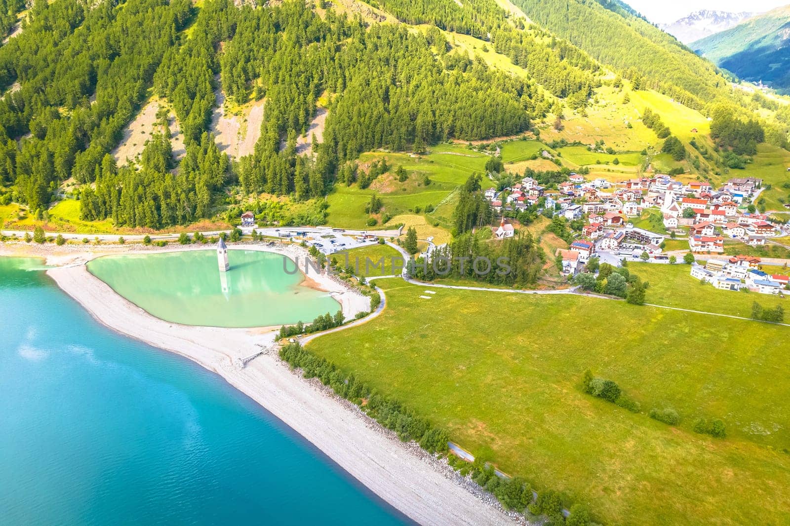 Curon Venosta. Submerged bell Tower in Graun im Vinschgau on Lake Reschen Alpine landscape aerial view by xbrchx
