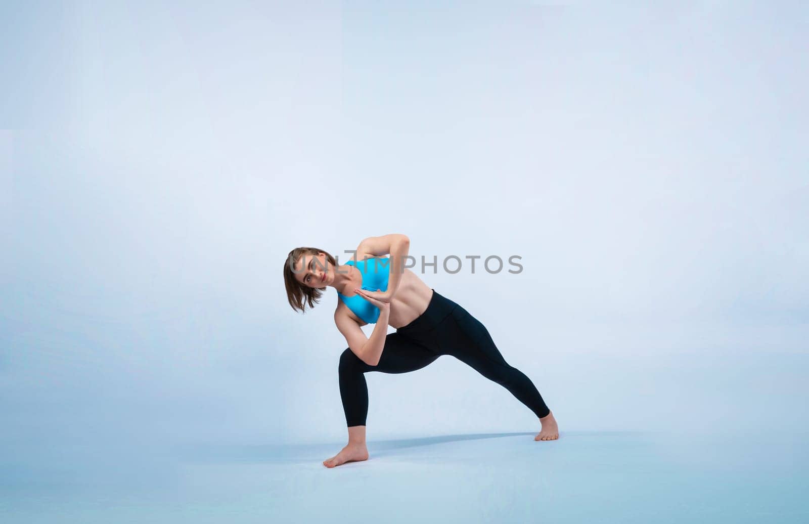 Full body length gaiety shot athletic and sporty woman doing healthy and meditative yoga exercise workout posture on isolated background. Healthy active and body care lifestyle