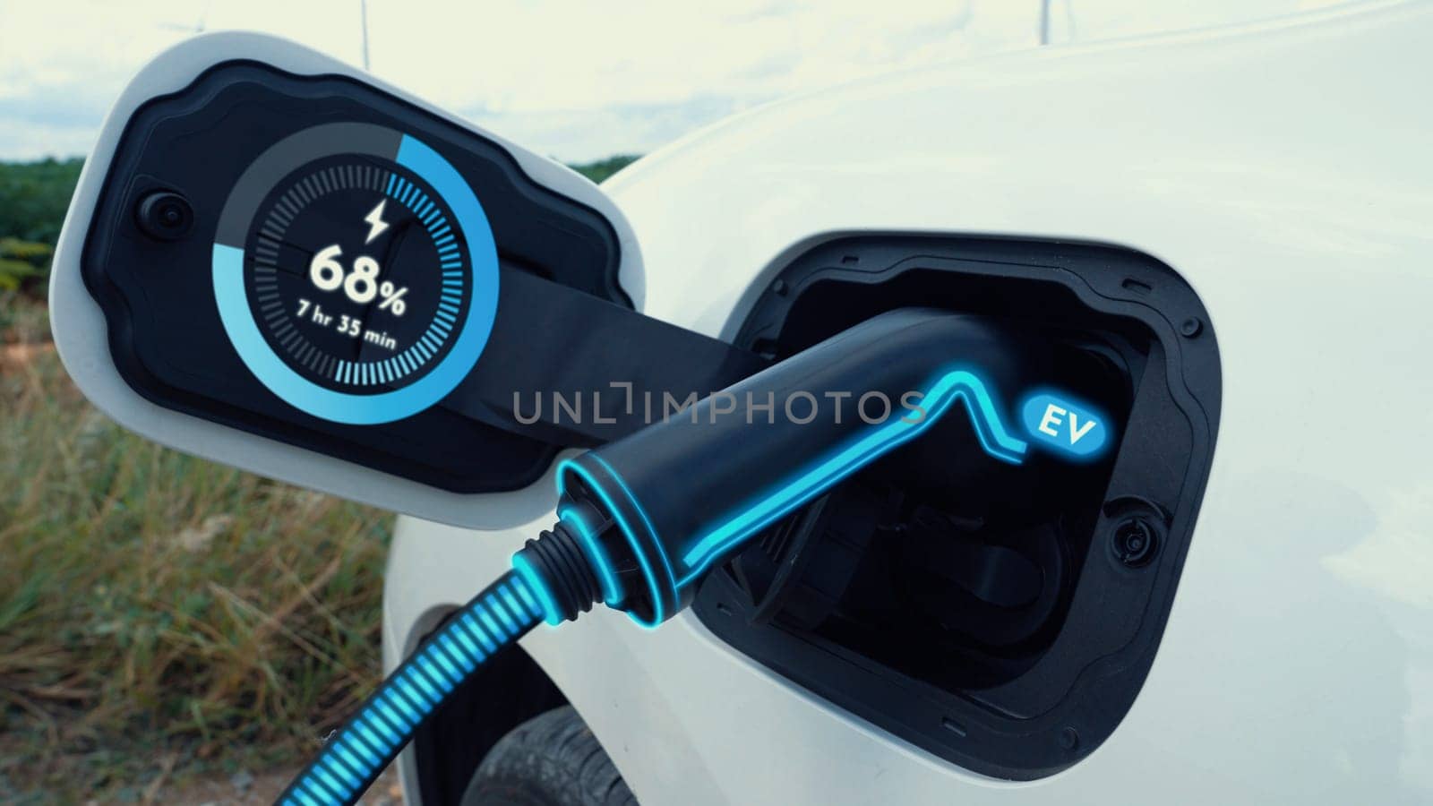 Electric car plug in with charging station,recharge battery by EV charger cable display smart digital battery status hologram in nature and mountain. Energy sustainability technological advance.Peruse