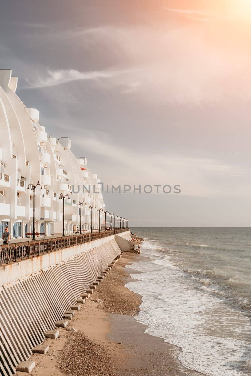 Coastal residential areas with a modern hotel and restaurant complex alongside sandy beaches. Summer holiday vacation and travel concept. by panophotograph