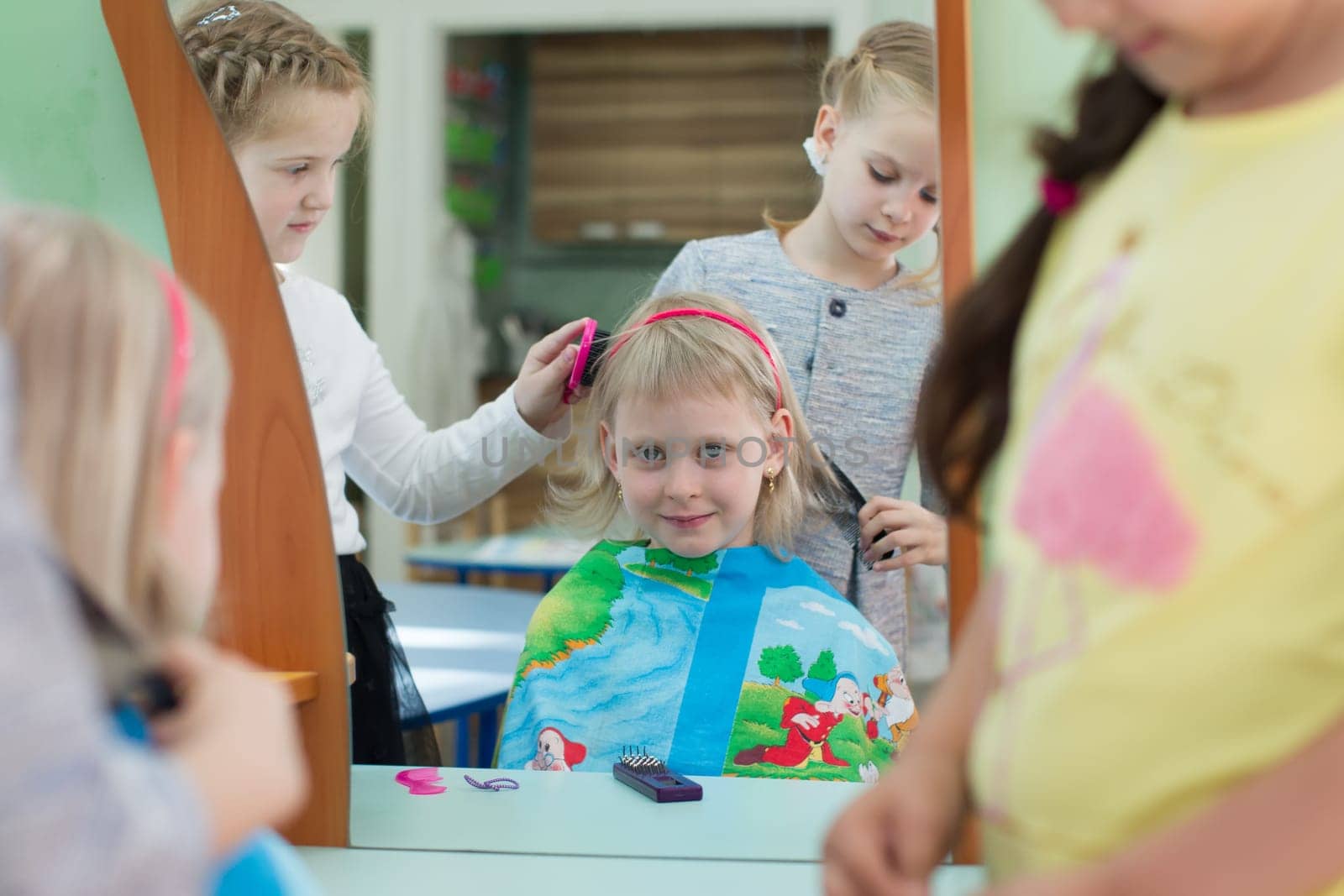 Belarus, Gomel, May 29, 2018. The kindergarten is central. Open Day.Pre-school girls play in the hairdresser