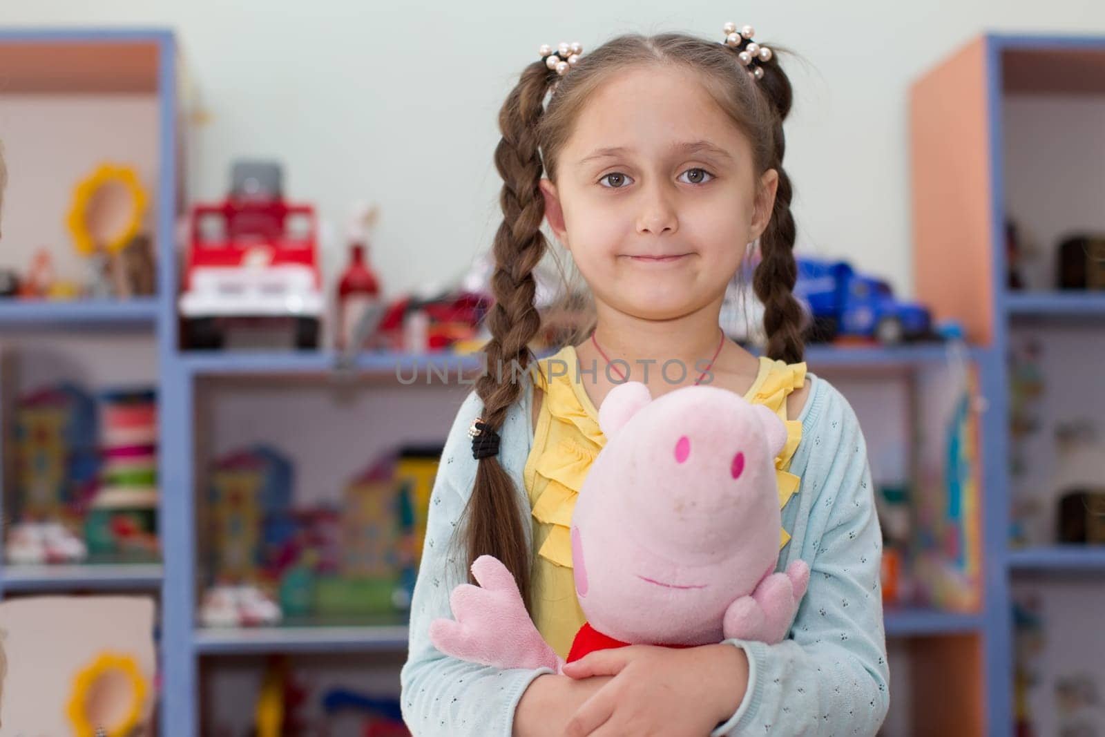 Belarus, Gomel, May 29, 2018. The kindergarten is central. Open Day.Portrait of a preschool child with a toy Pippi
