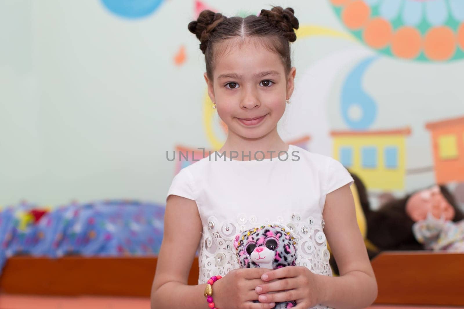 Belarus, Gomel, May 29, 2018. The kindergarten is central. Open Day.Portrait of a preschool girl with a toy in her hands