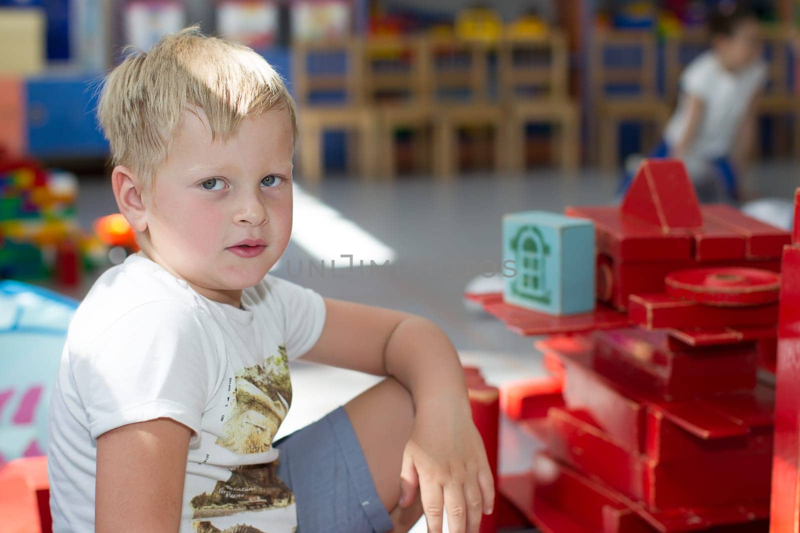 Belarus, Gomel, May 29, 2018. The kindergarten is central. Open Day.A boy in kindergarten plays in a wooden constructor