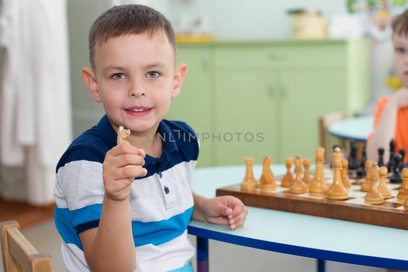 Belarus, Gomel, May 29, 2018. The kindergarten is central. Open Day.A preschool boy is smiling at a toy background.Cheerful child in kindergarten