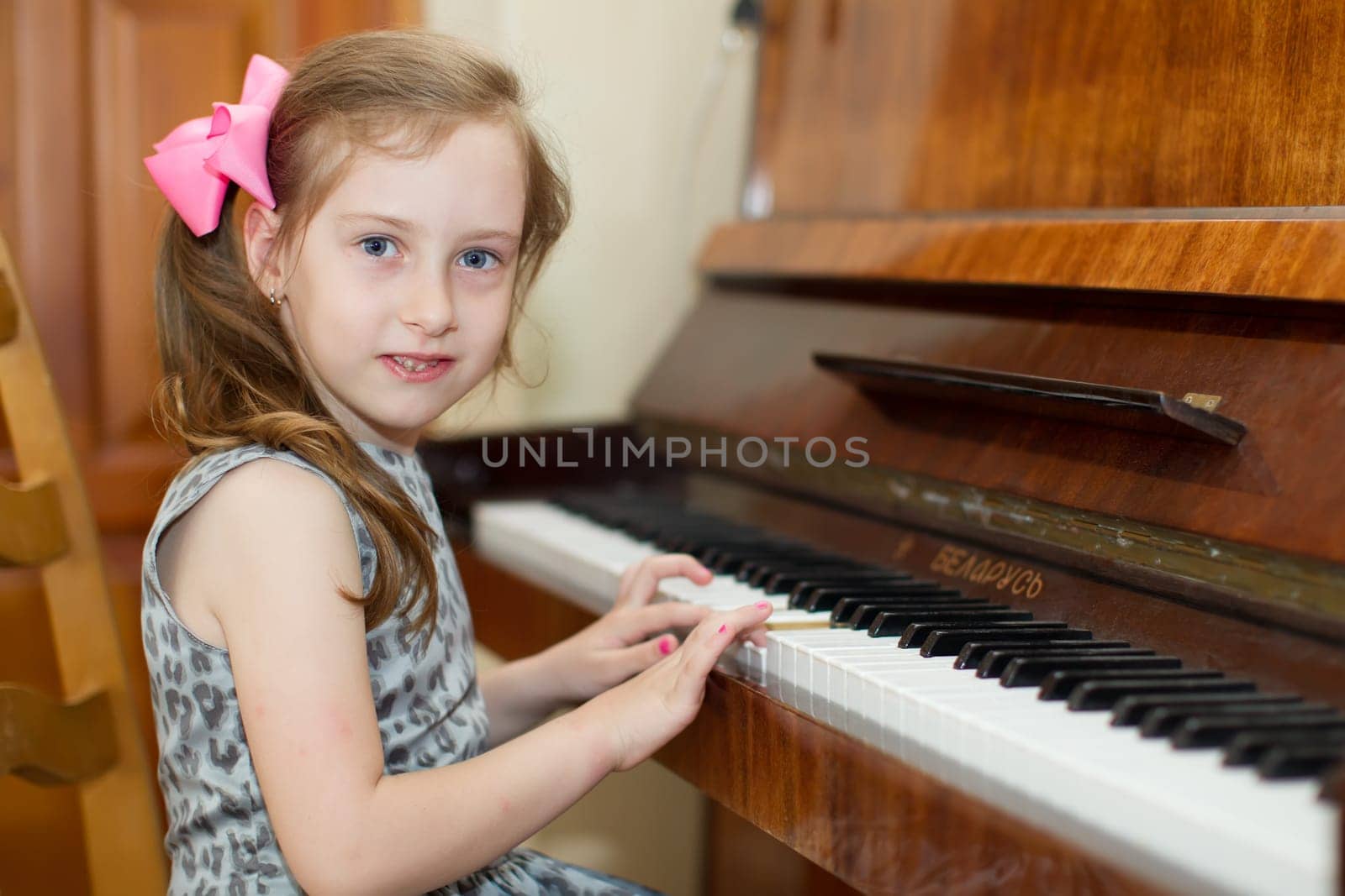 Belarus, Gomel, May 29, 2018. The kindergarten is central. Open Day.Child plays the piano.Preschool Music Education for Children