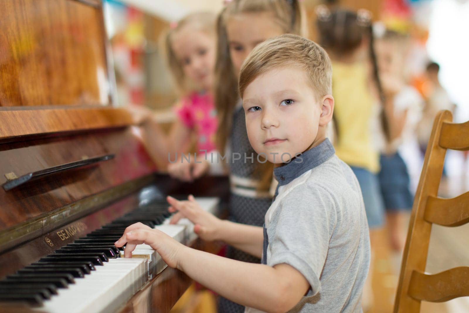Belarus, Gomel, May 29, 2018. The kindergarten is central. Open Day.Child plays the piano.Preschool Music Education for Children by Sviatlana