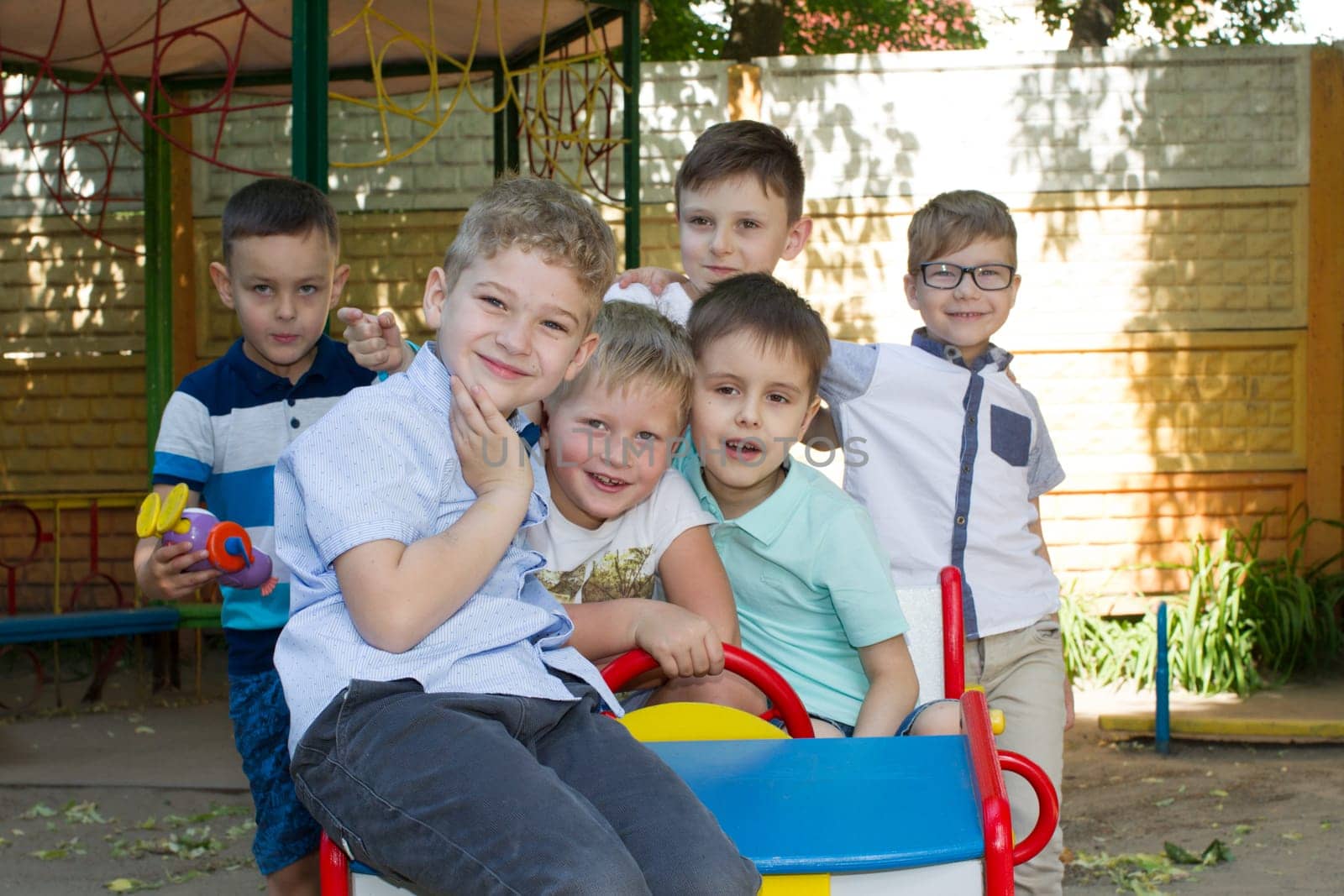 Belarus, Gomel, May 29, 2018. The kindergarten is central. Open Day.Group of preschool boys on the street in kindergarten by Sviatlana