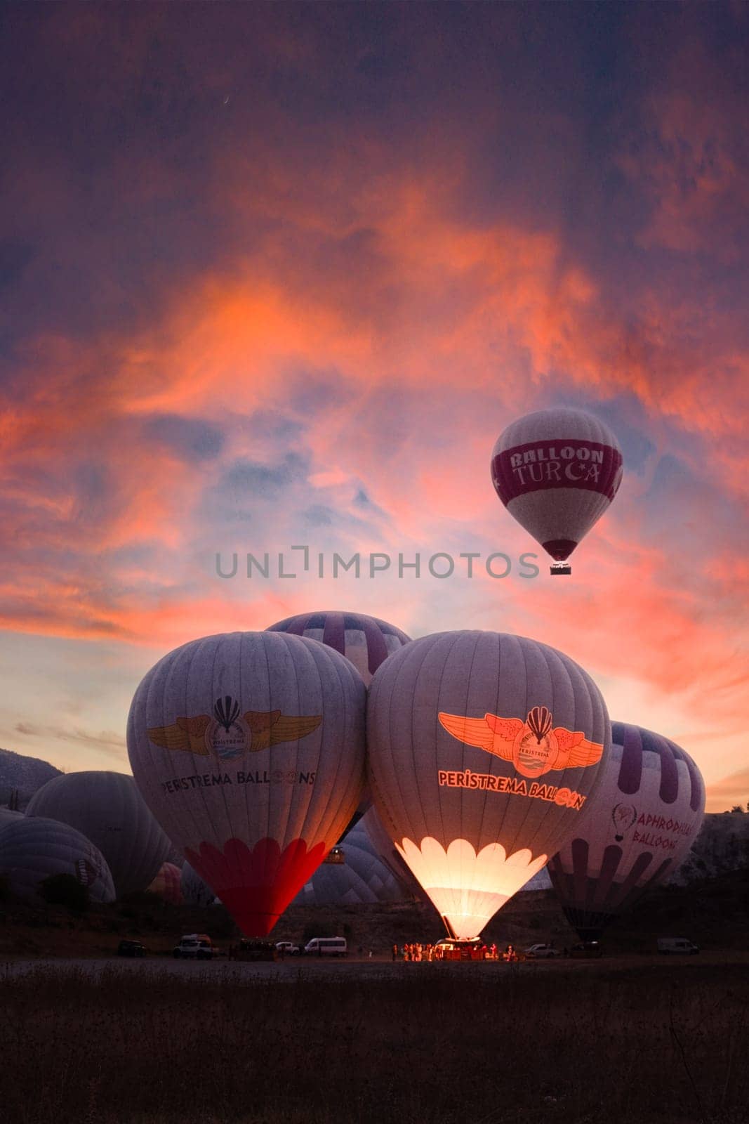 Landscape of Pamukkale park and a lot of hot air balloons in the morning sky . Turkey-october 2023. High quality photo
