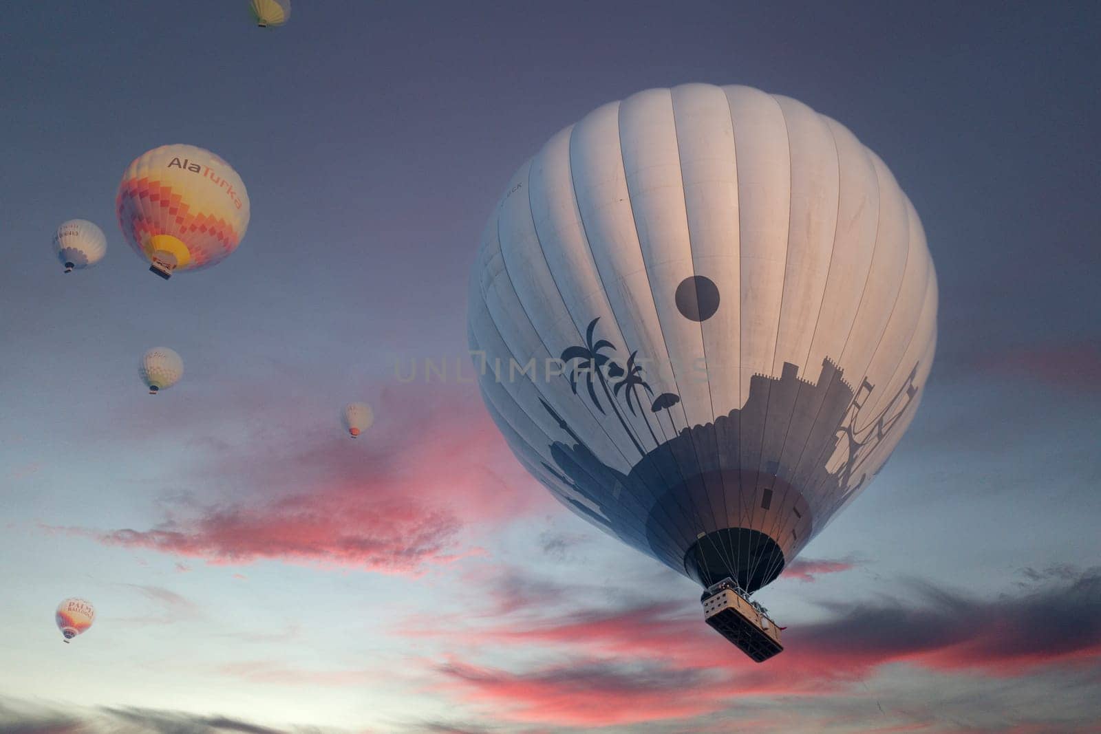 Landscape of Pamukkale park and a lot of hot air balloons in the morning sky . Turkey-october 2023. High quality photo