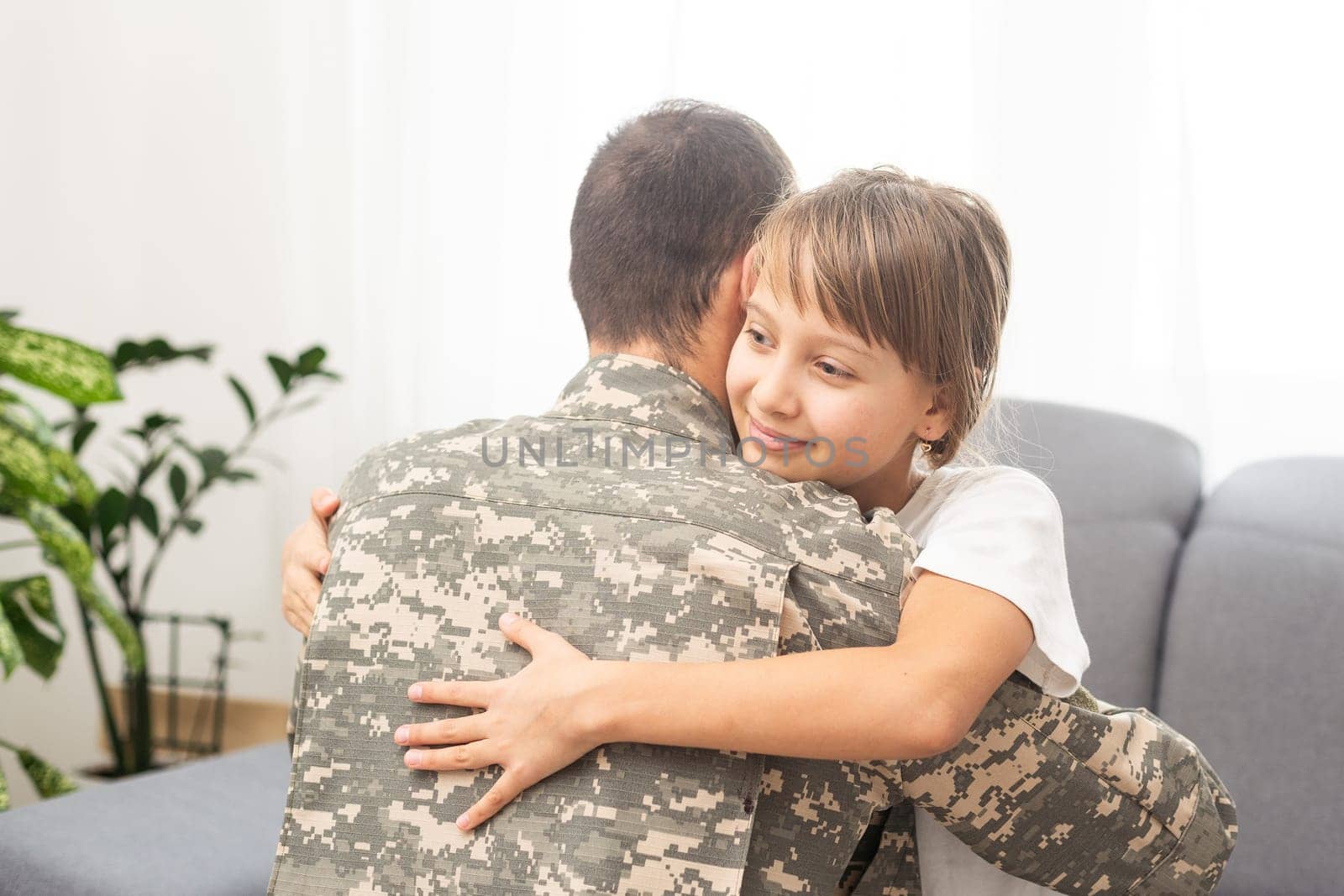 Military dad hugging his daughter by Andelov13