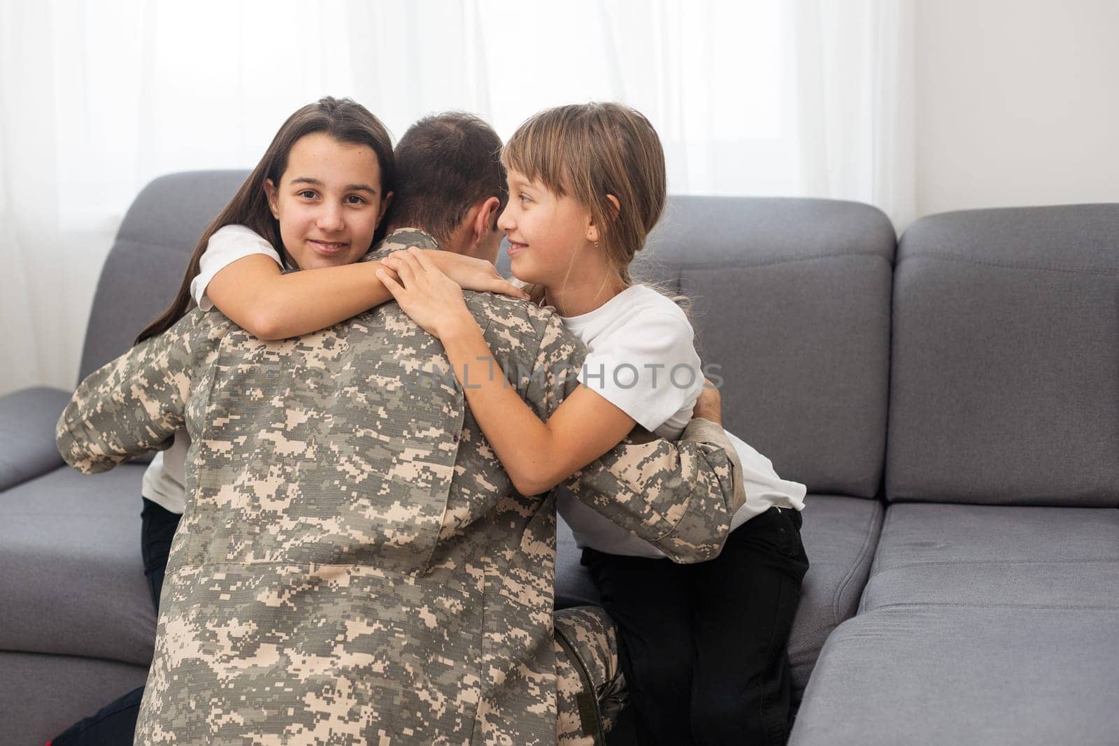 military father and two daughters at home. High quality photo