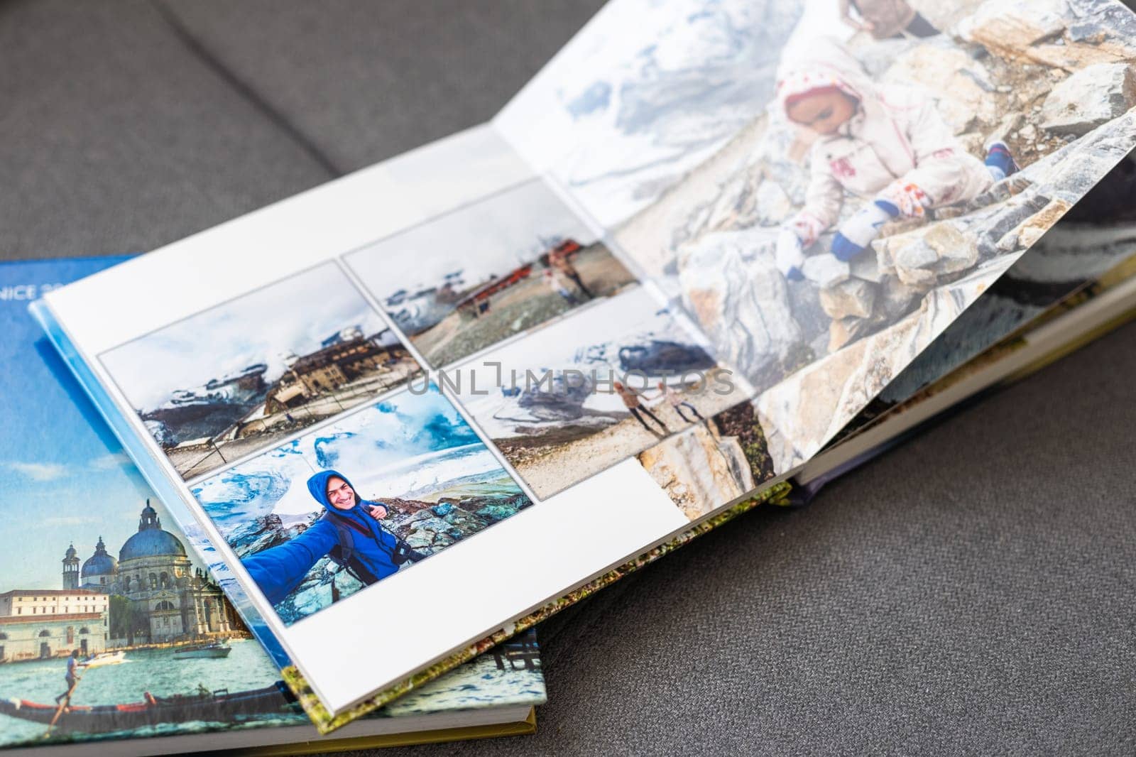 a Photobook of family at home on a background. Photobook is gift. professional photographer and designer. printing of photos and journals in photo laboratory by Andelov13