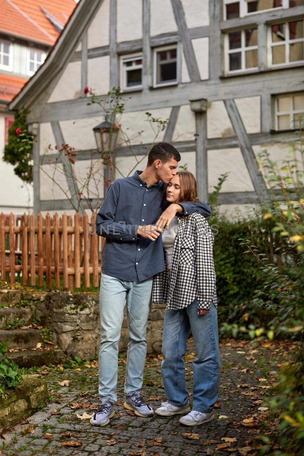 Young Cute Female Hugs Boyfriend. In Autumn Outdoor. Lovers Walking in Park. Attractive Funny Couple. Lovestory in Forest. Man and Woman. Cute Lovers in the Park. Family Concept. Happy Couple.