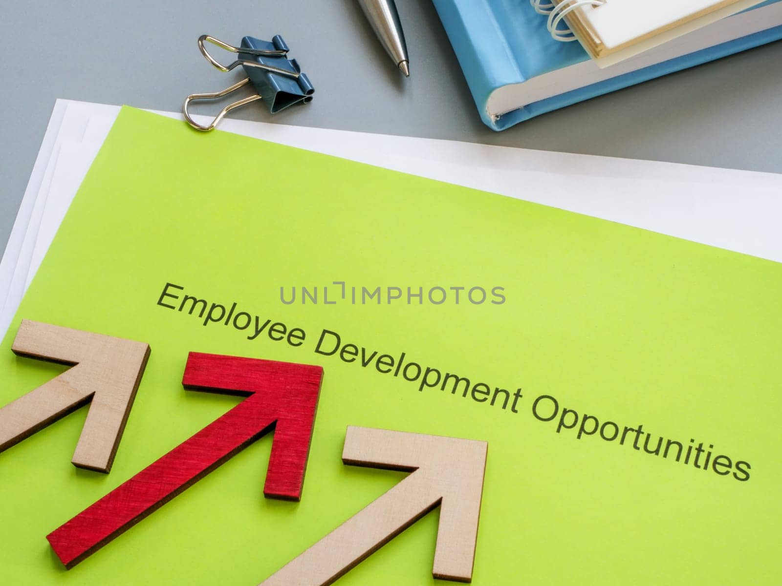 Employee development opportunities documents and arrows. by designer491