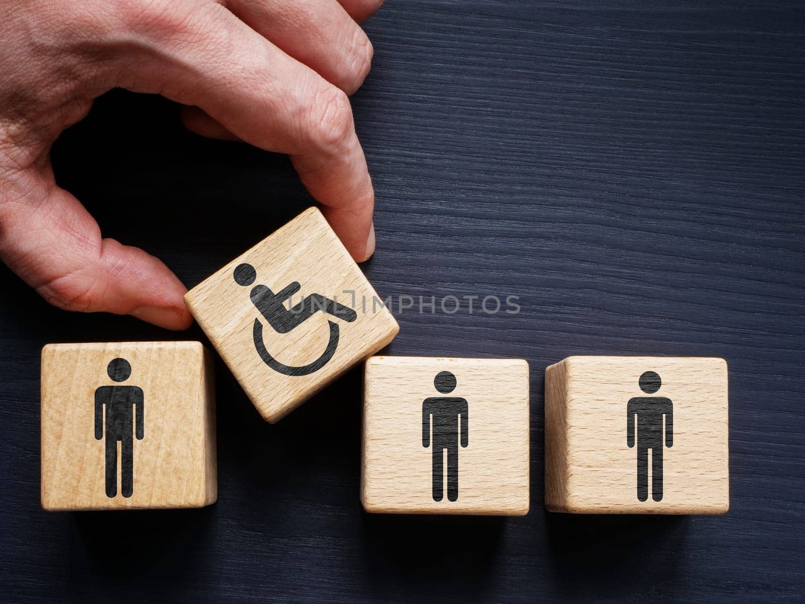 Supported Employment and inclusion. Cubes with employees and hand holding with disabled person sign. by designer491