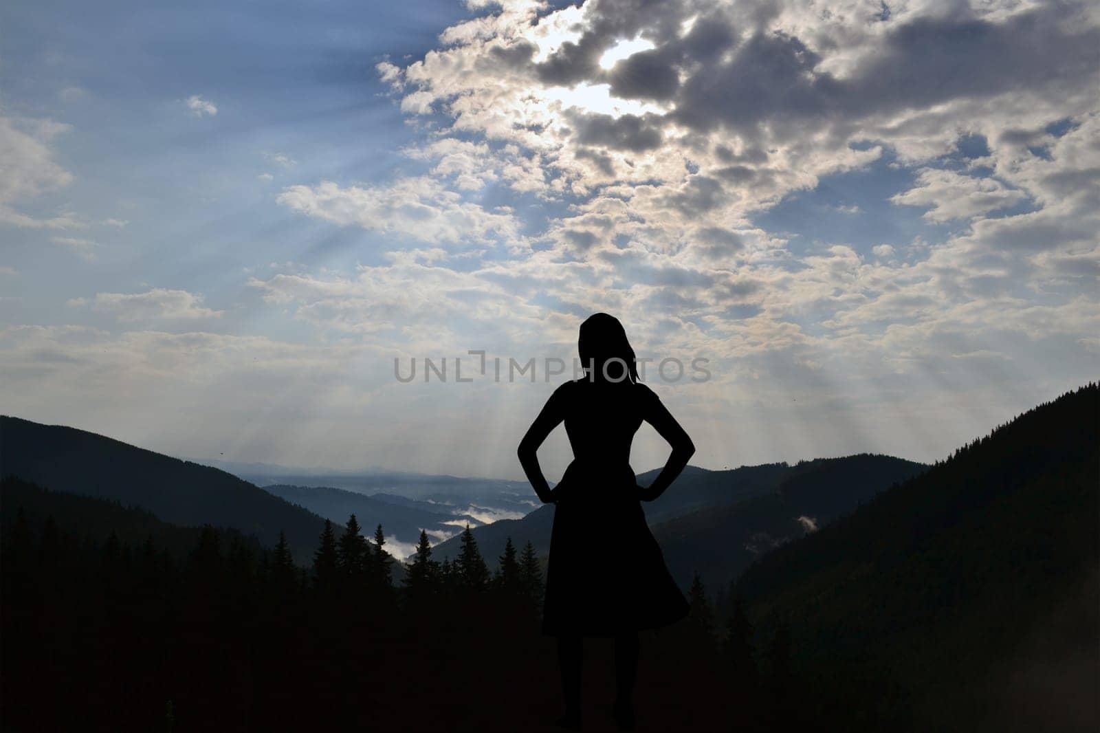 Woman contemplating a mountains landscape