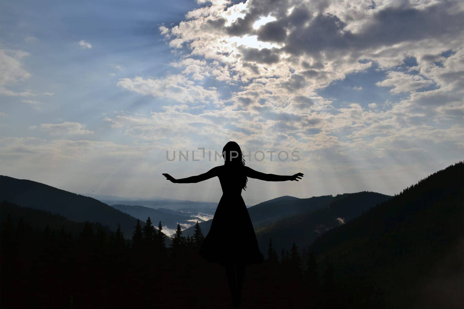 Spreading arms woman silhouette enjoying nature
