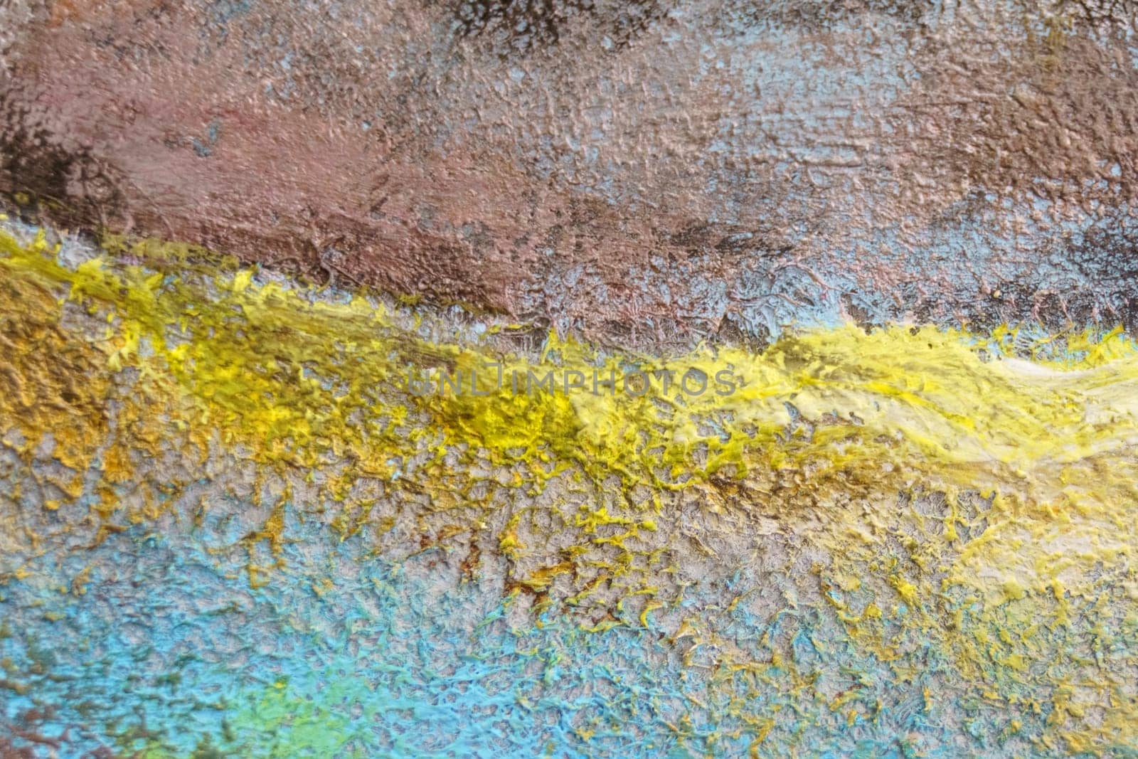 Bright texture of canvas painted in blue-yellow-brown colors with shades. Abstract background