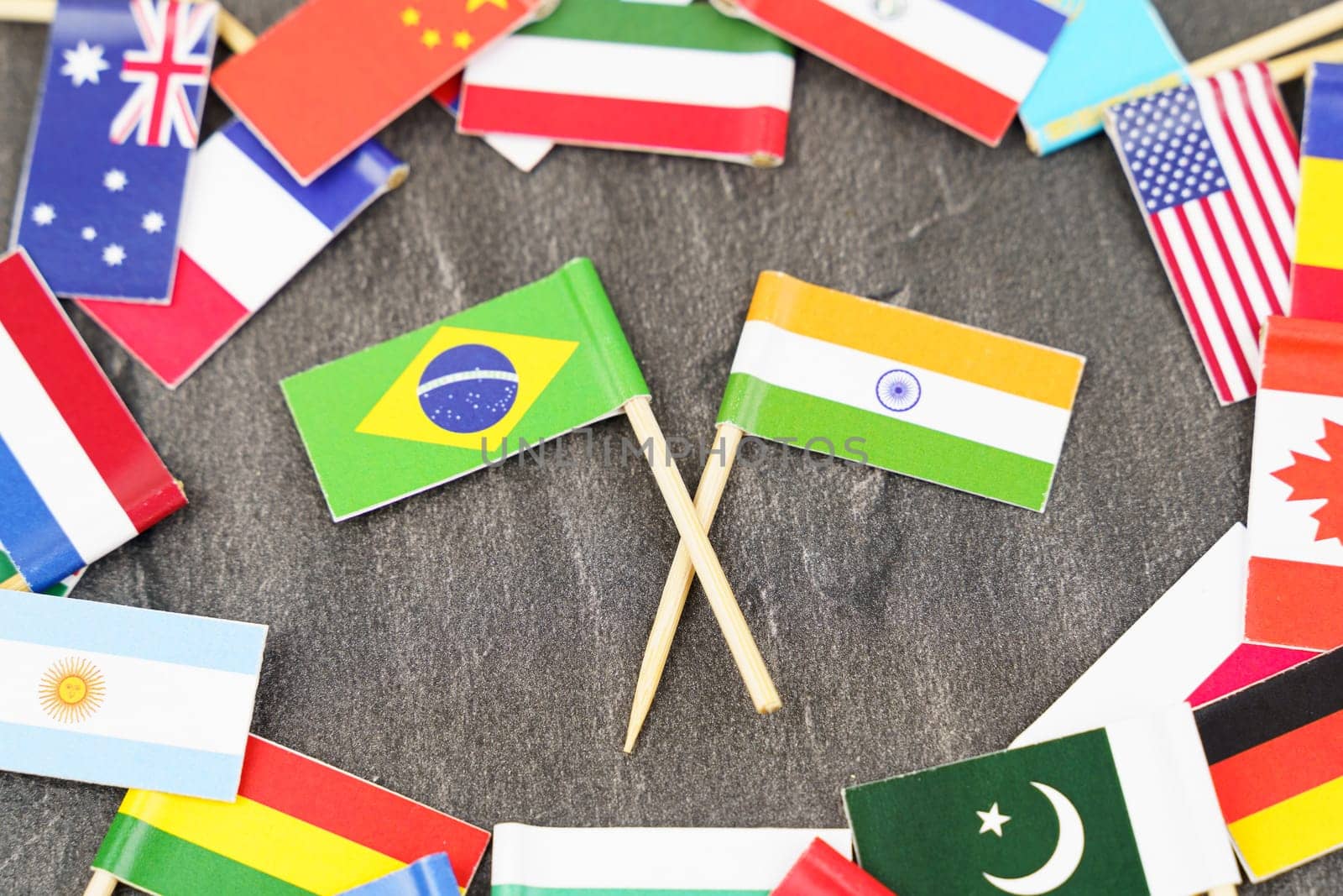 Policy. National flags of different countries. The concept is diplomacy. In the middle among the various flags are two flags - India, Brazil