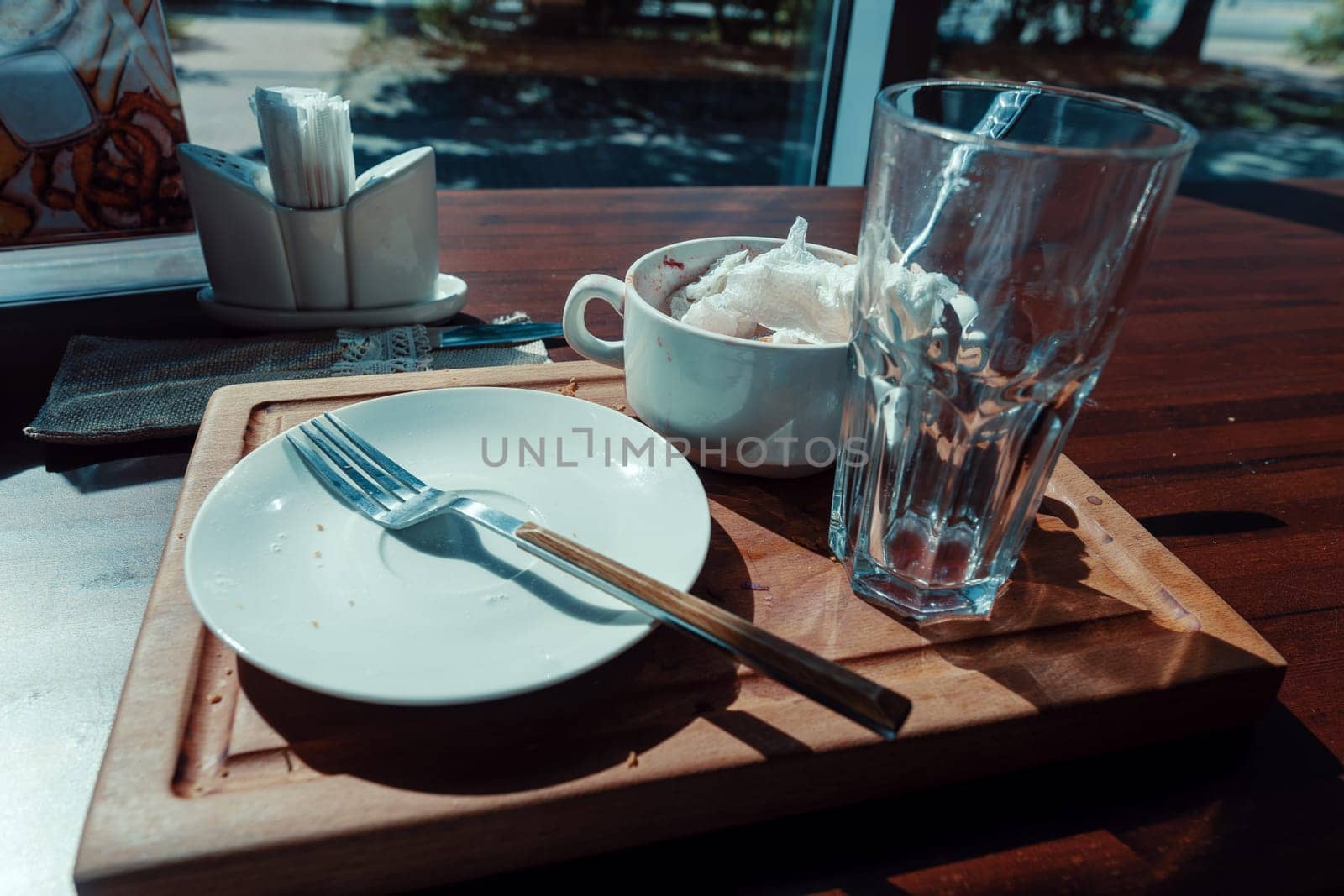 dirty dishes on a wooden tray by krol666