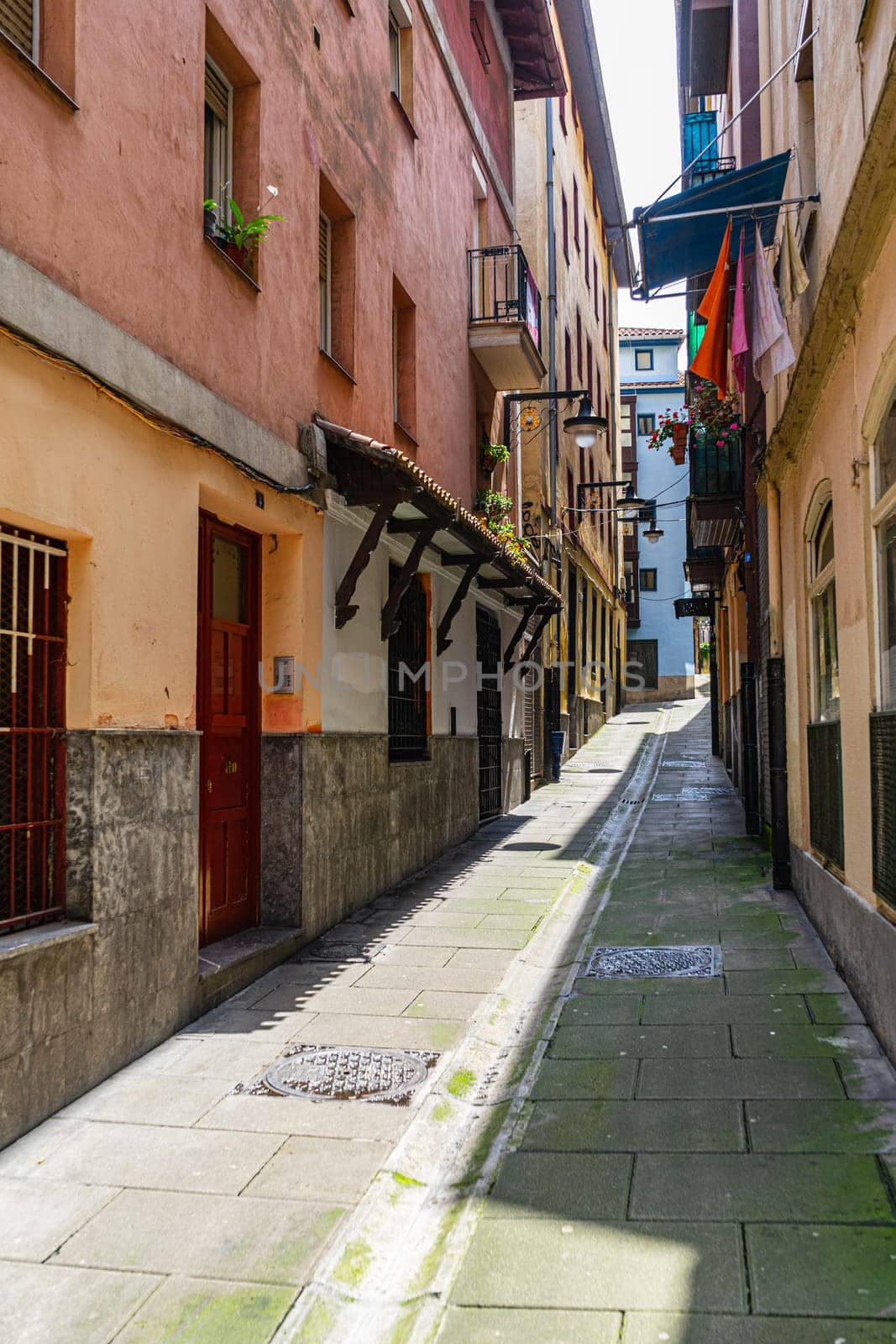 The narrow street of the old European city, Portugalete, Basque Country, Spain