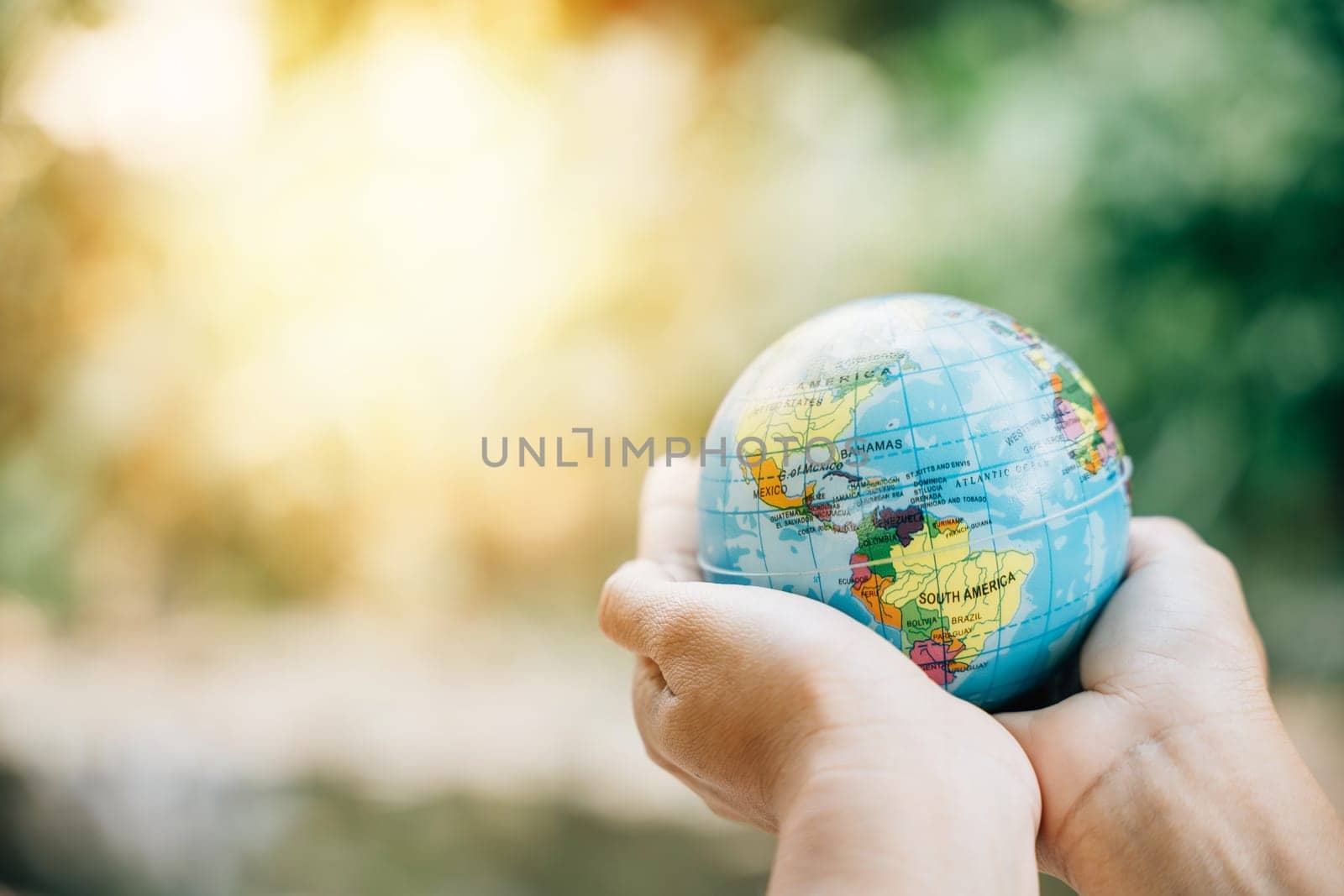 Green Planet in Your Hands - a symbol of saving Earth This concept for Environment and Earth Day emphasizes responsibility, wisdom, and global support for our environment. by Sorapop