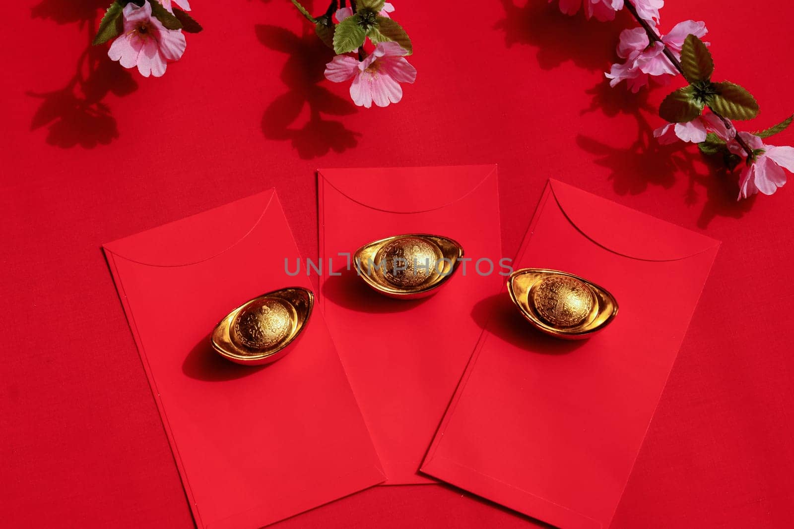 Chinese New Year Spring festival decorations red packet and gold ingots. by JennMiranda