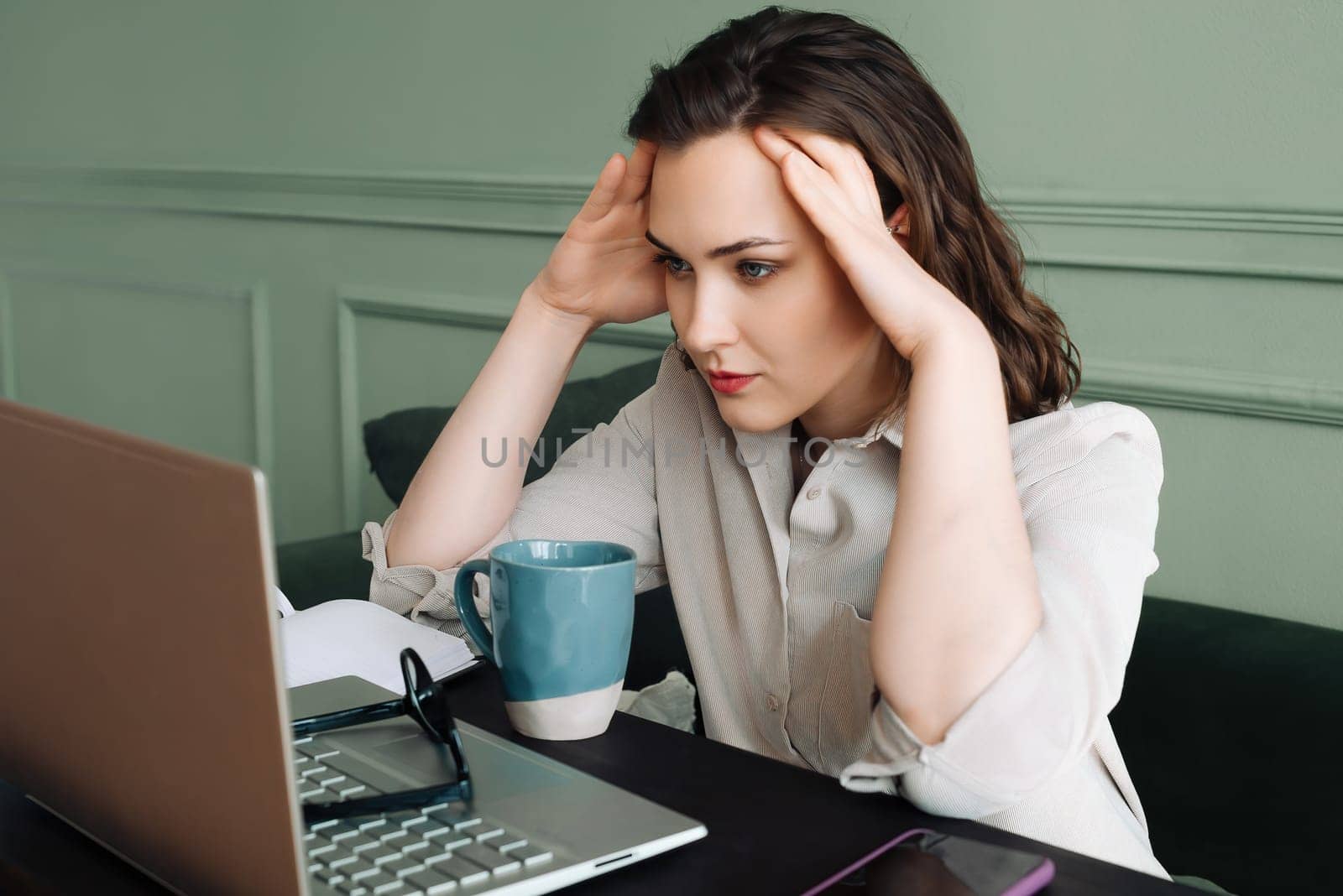 Health Concerns and Laptop Stress. Unhappy Woman Seeking Relief. Work-Induced Health Struggles: Unhappy Woman at Laptop. Balancing Health and Work. Unhappy Woman Dealing with Laptop Stress.