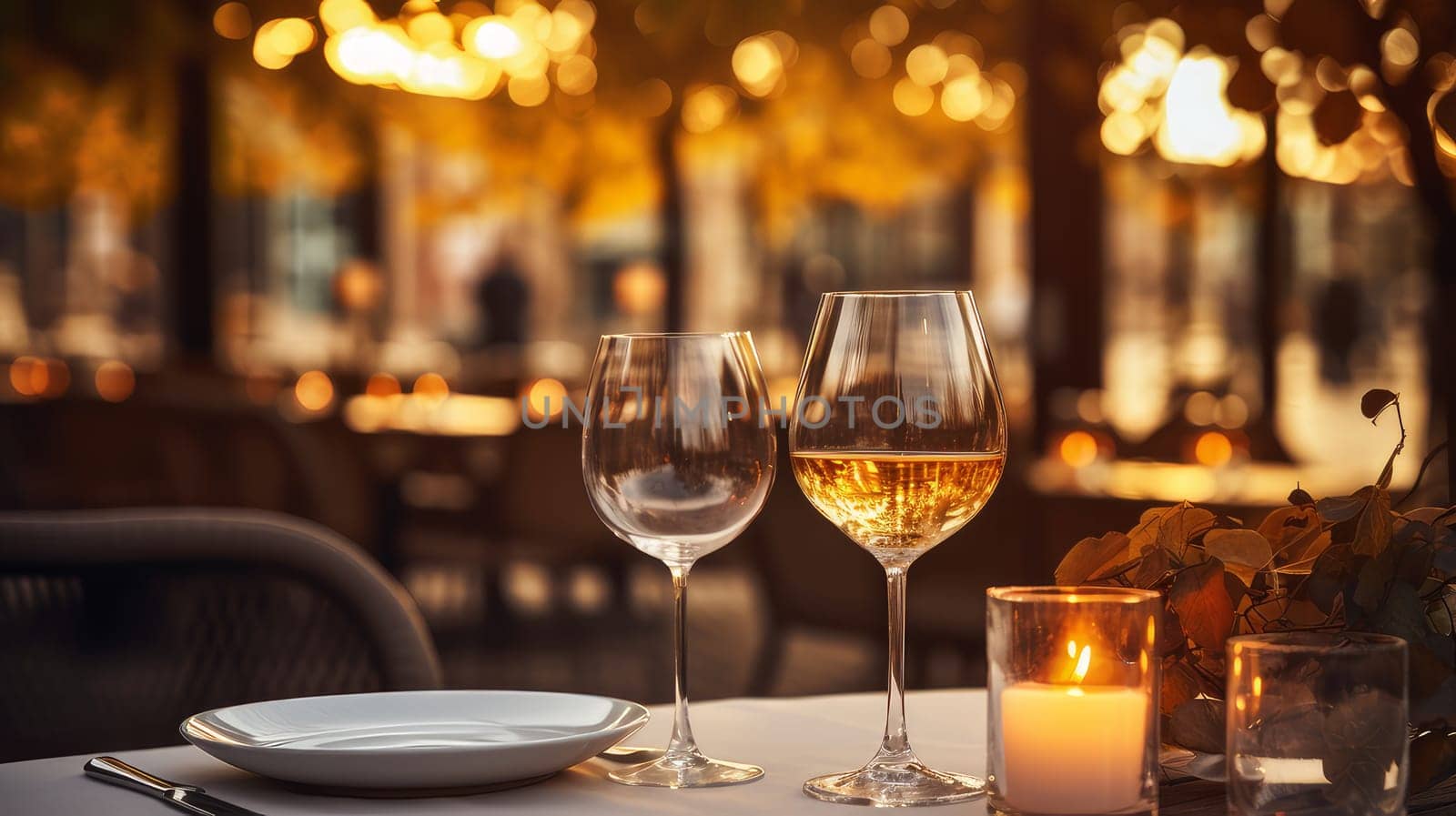 Dinner in a chic restaurant, on the terrace in the fresh air, by candlelight with a glass of champagne or wine, with beautiful glowing lights. Valentine's day, newlyweds, engagement, holiday, birthday, wedding, anniversary, surprise, date.