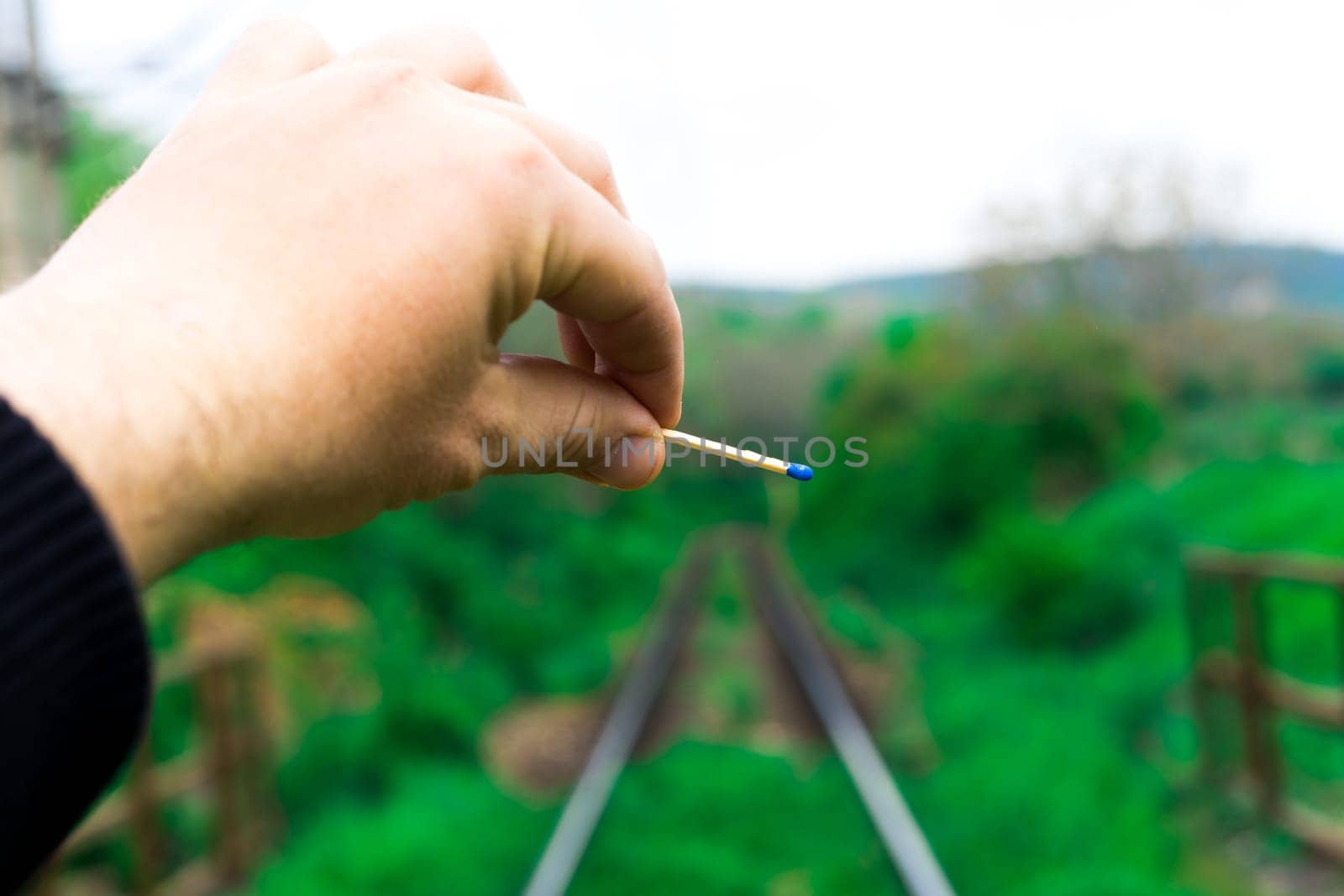 Matches on a rails railroad tracks background, fire on railways concept