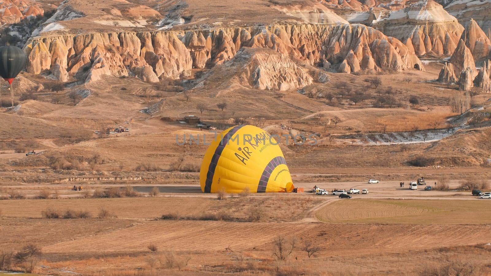 Inflating a balloon with fire. Cappadocia, Turkey