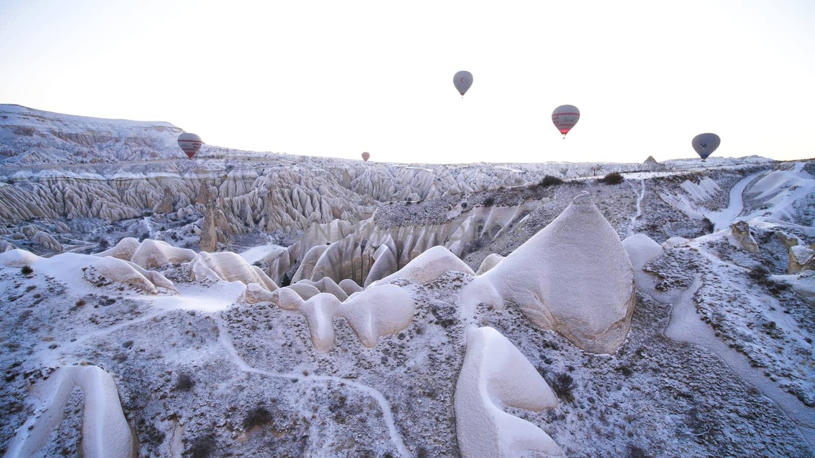 Multi-colored balls in Cappadocia on the background of volcanic rocks. by DovidPro