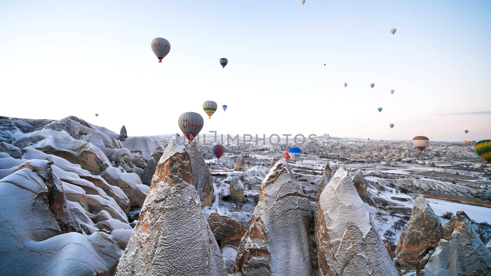 Multi-colored balls in Cappadocia on the background of volcanic rocks. by DovidPro