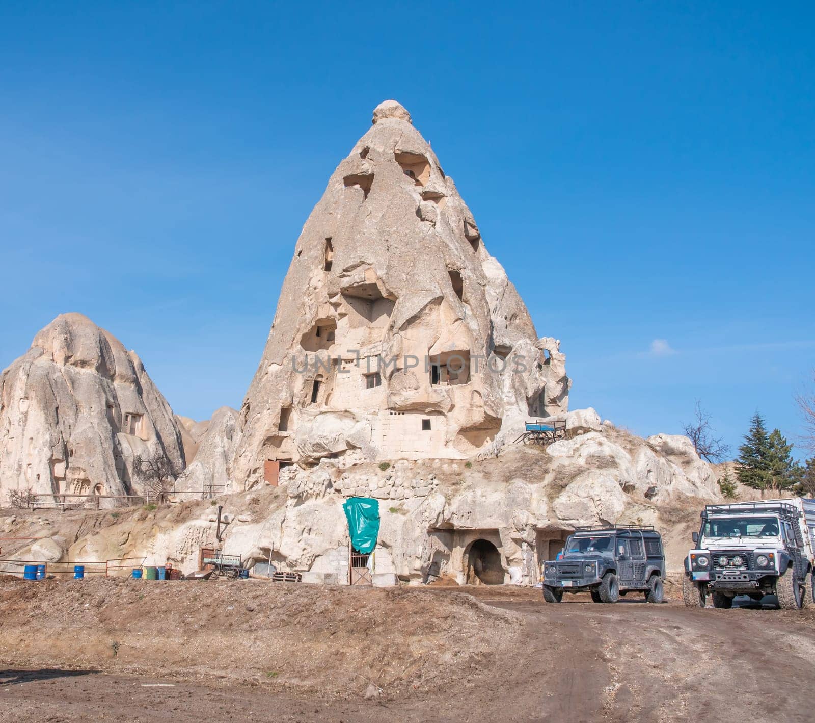 Volcanic mountain with windows near the city of Goreme in Turkey. Cappadocia. by DovidPro