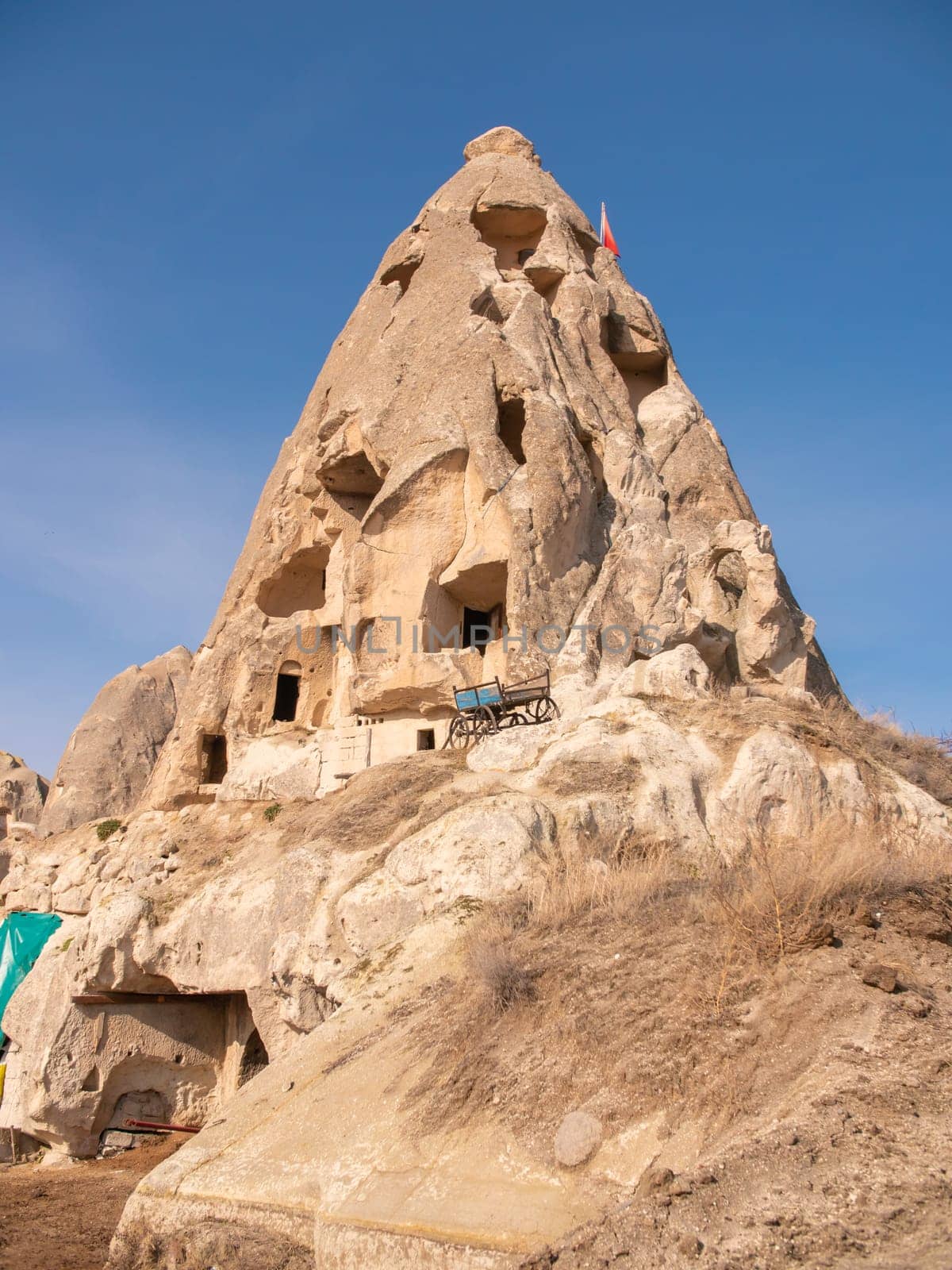 Volcanic mountain with windows near the city of Goreme in Turkey. Cappadocia