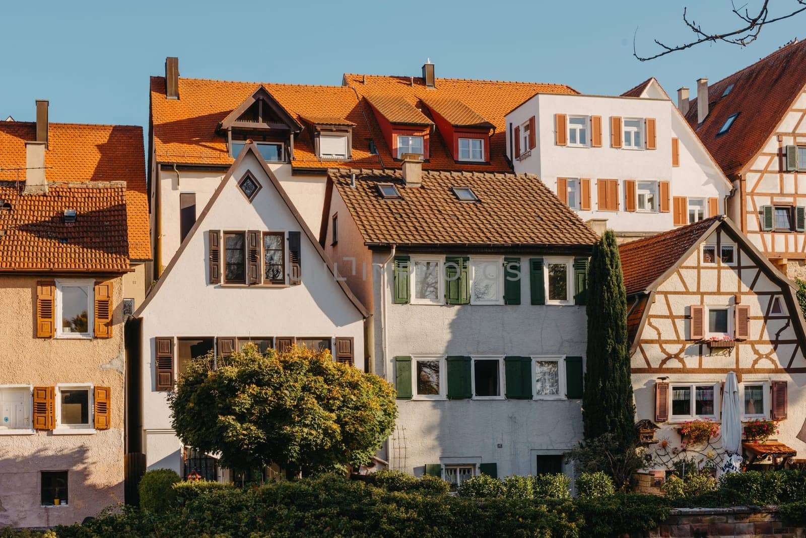 Old national German town house. Old Town is full of colorful and well preserved buildings. Baden-Wurttemberg is a state in southwest Germany bordering France and Switzerland. The Black Forest, known for its evergreen scenery and traditional villages, lies in the mountainous southwest. Stuttgart, the capital, is home to Wilhelma, a royal estate turned zoo and gardens. Porsche and Mercedes-Benz have headquarters and museums there. The 19th-century Hohenzollern Castle sits in the Swabian Alps to the south.